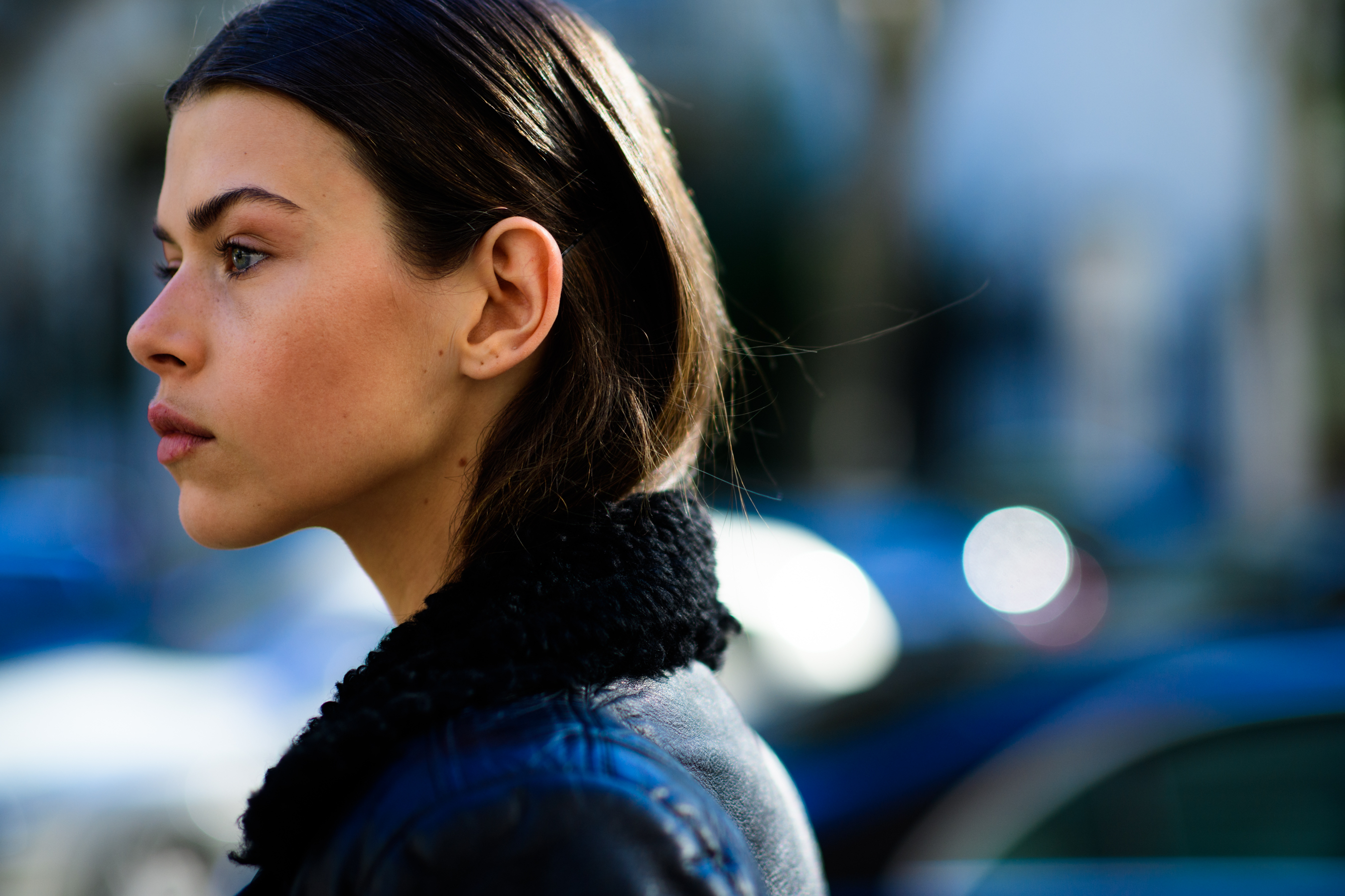 Side profile of model with blue eyes