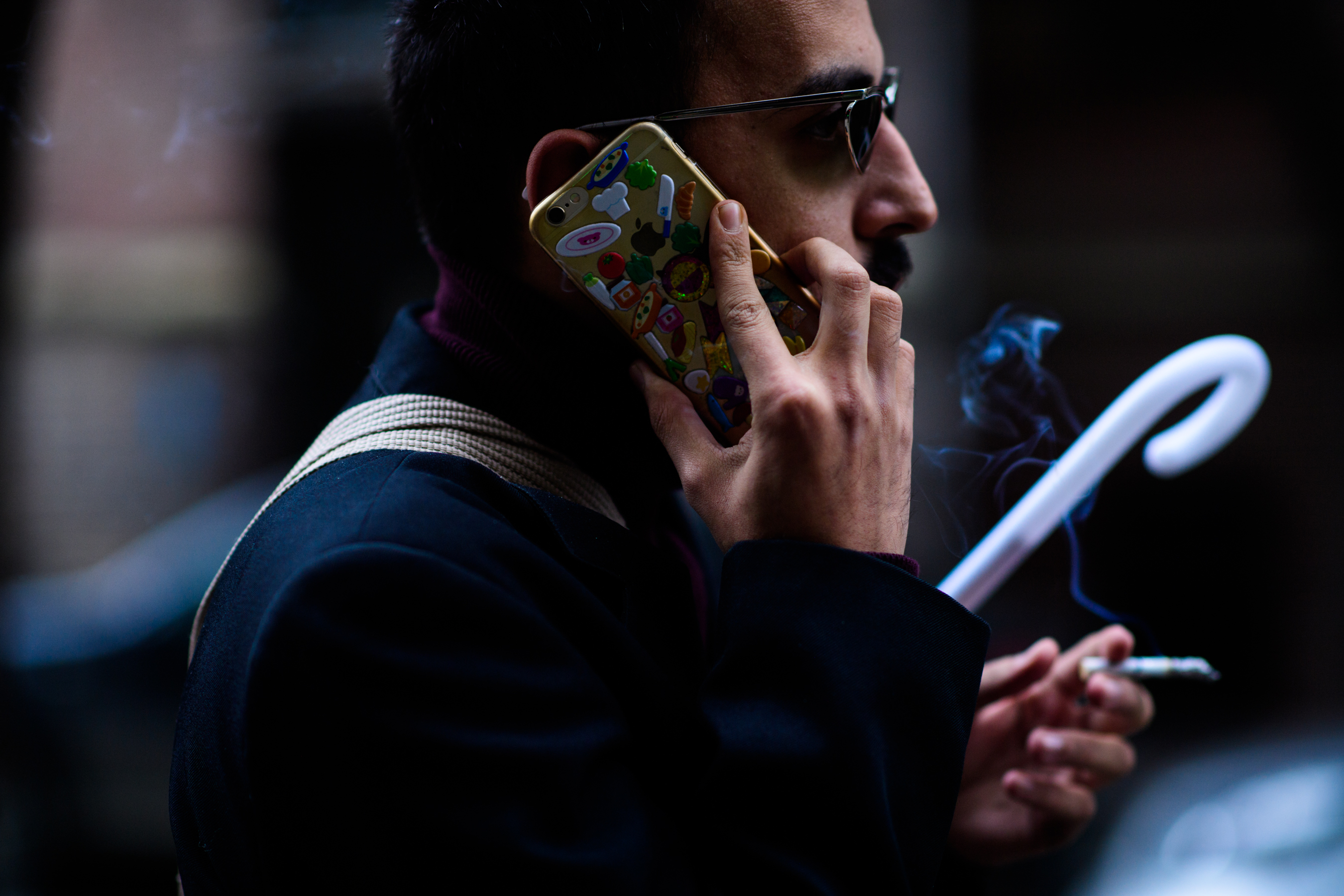 Georgian man with phone covered with stickers