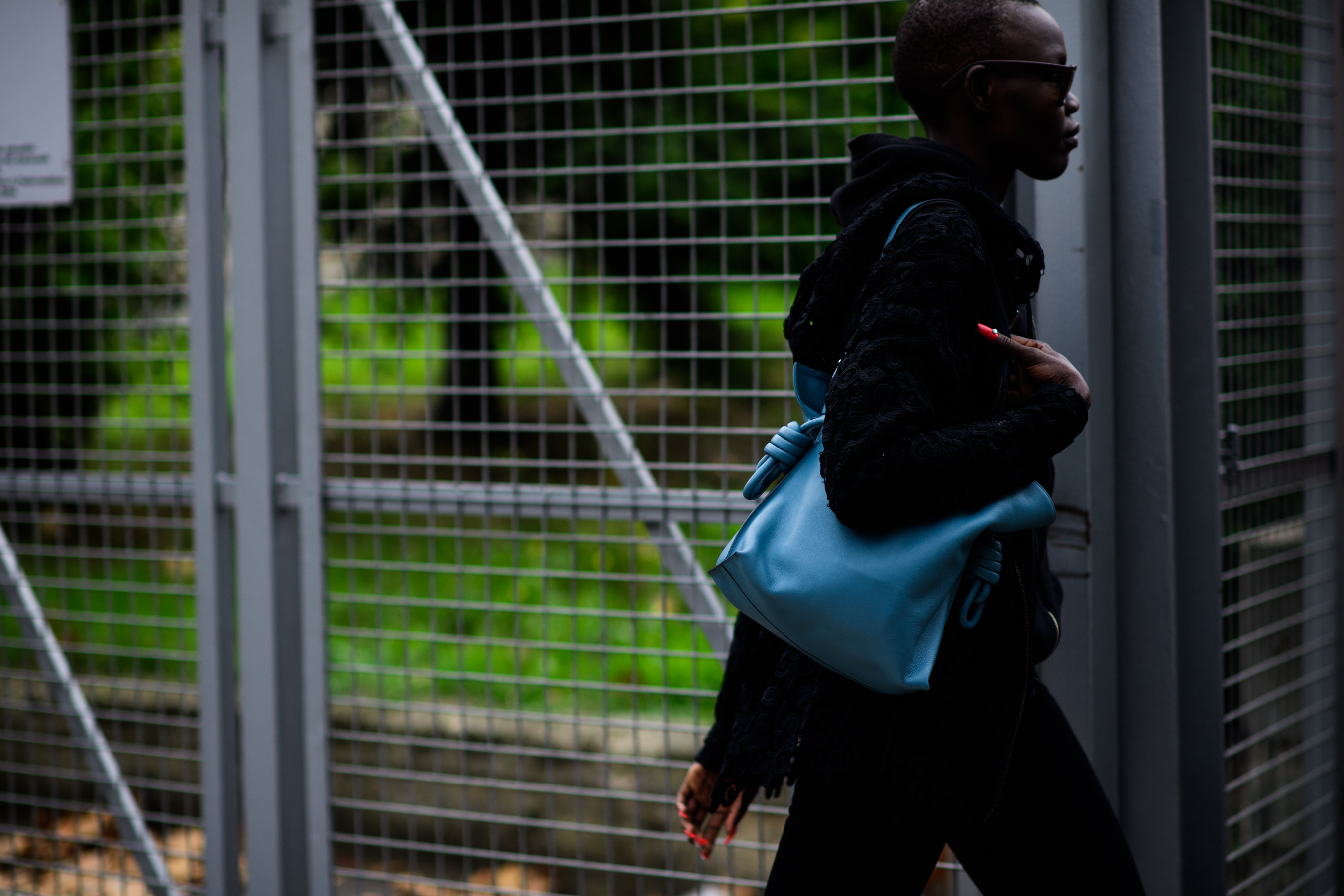 South Sudanese model holding blue bag