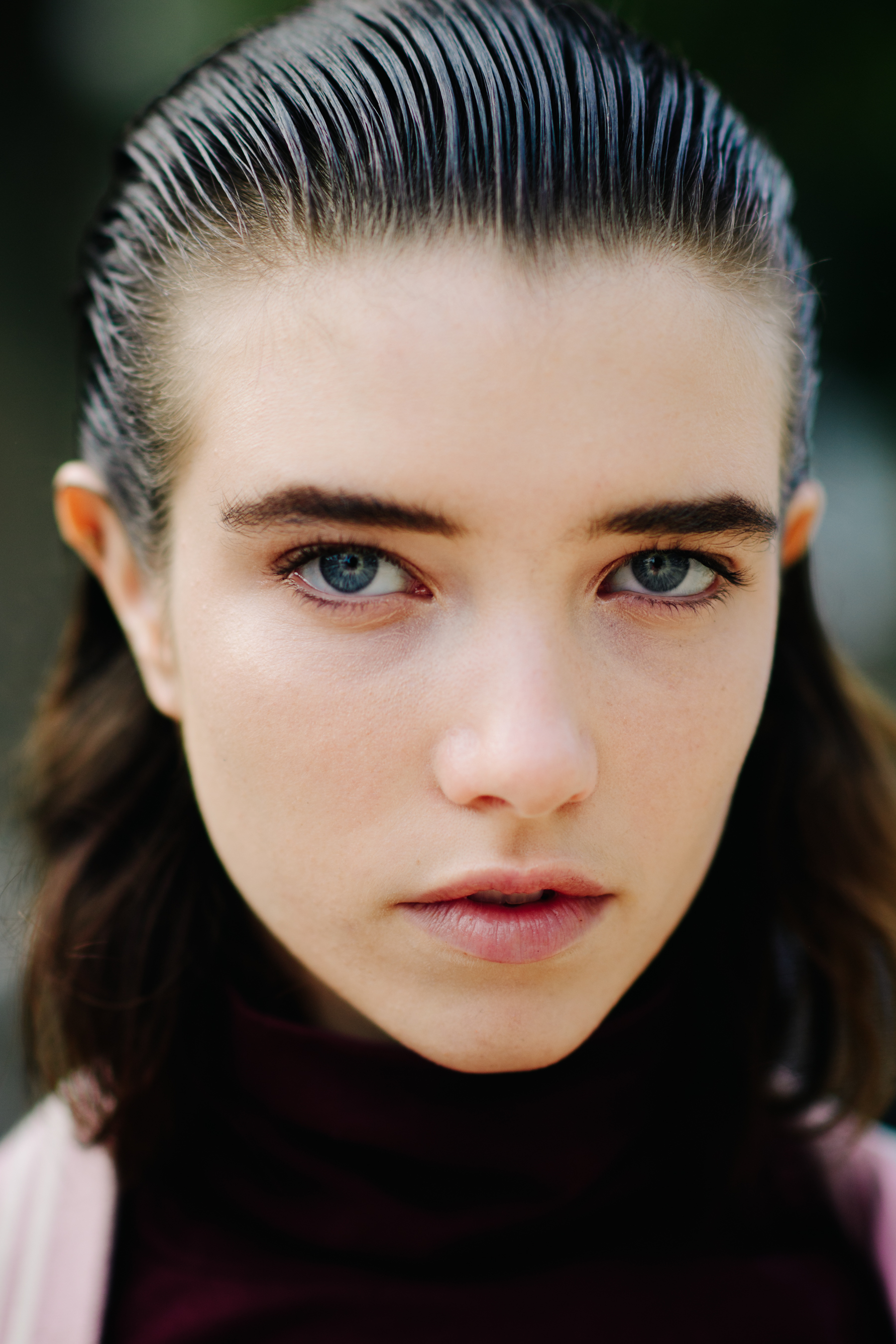 Portrait of model with blue eyes and combed wet hair