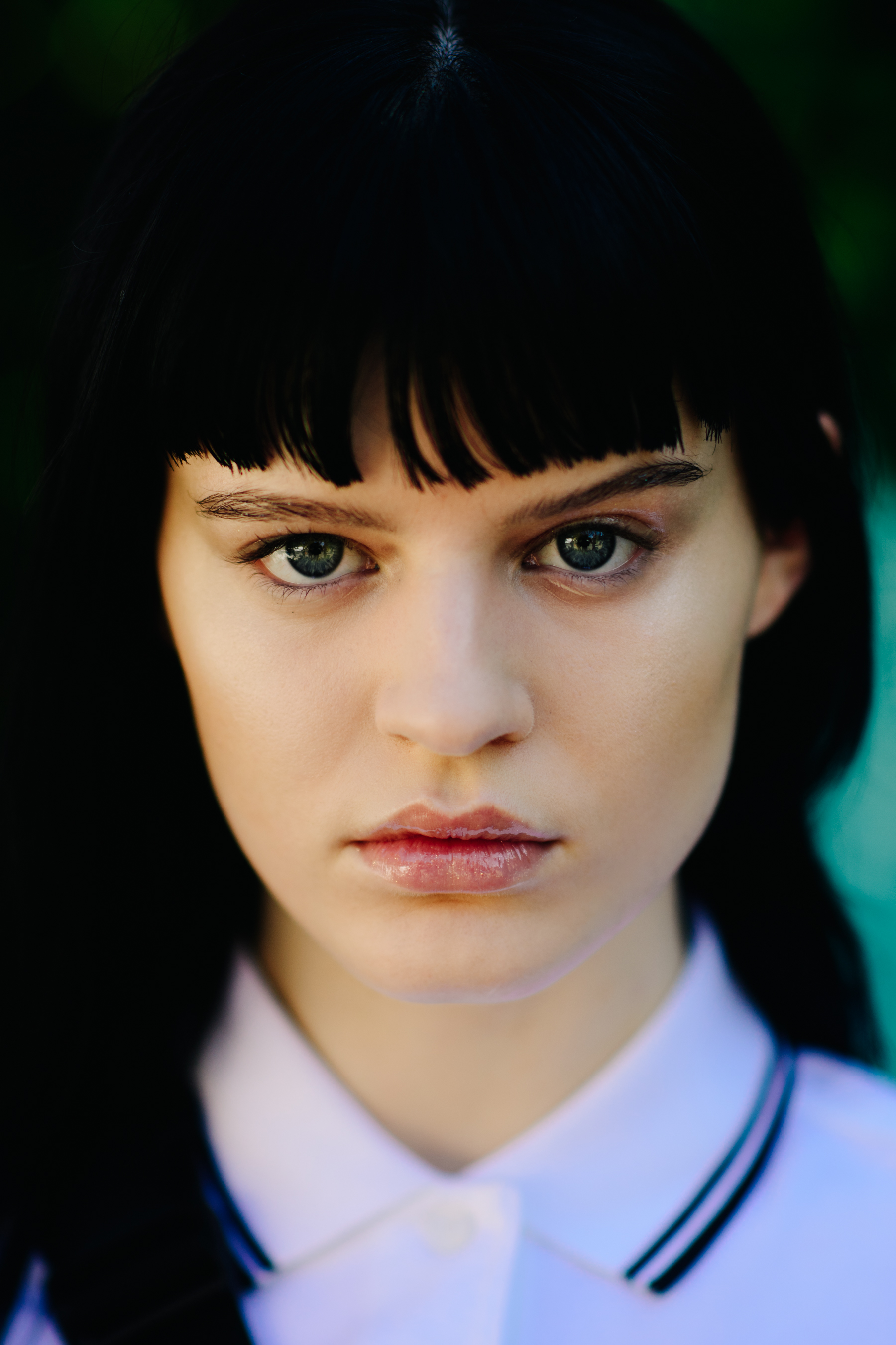 Portrait of model with black block fringe