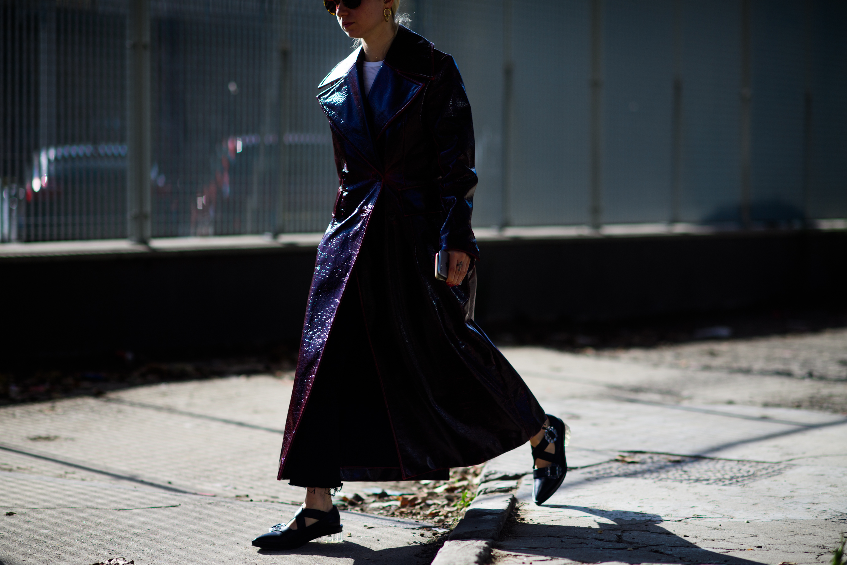 British editor wearing long purple coat