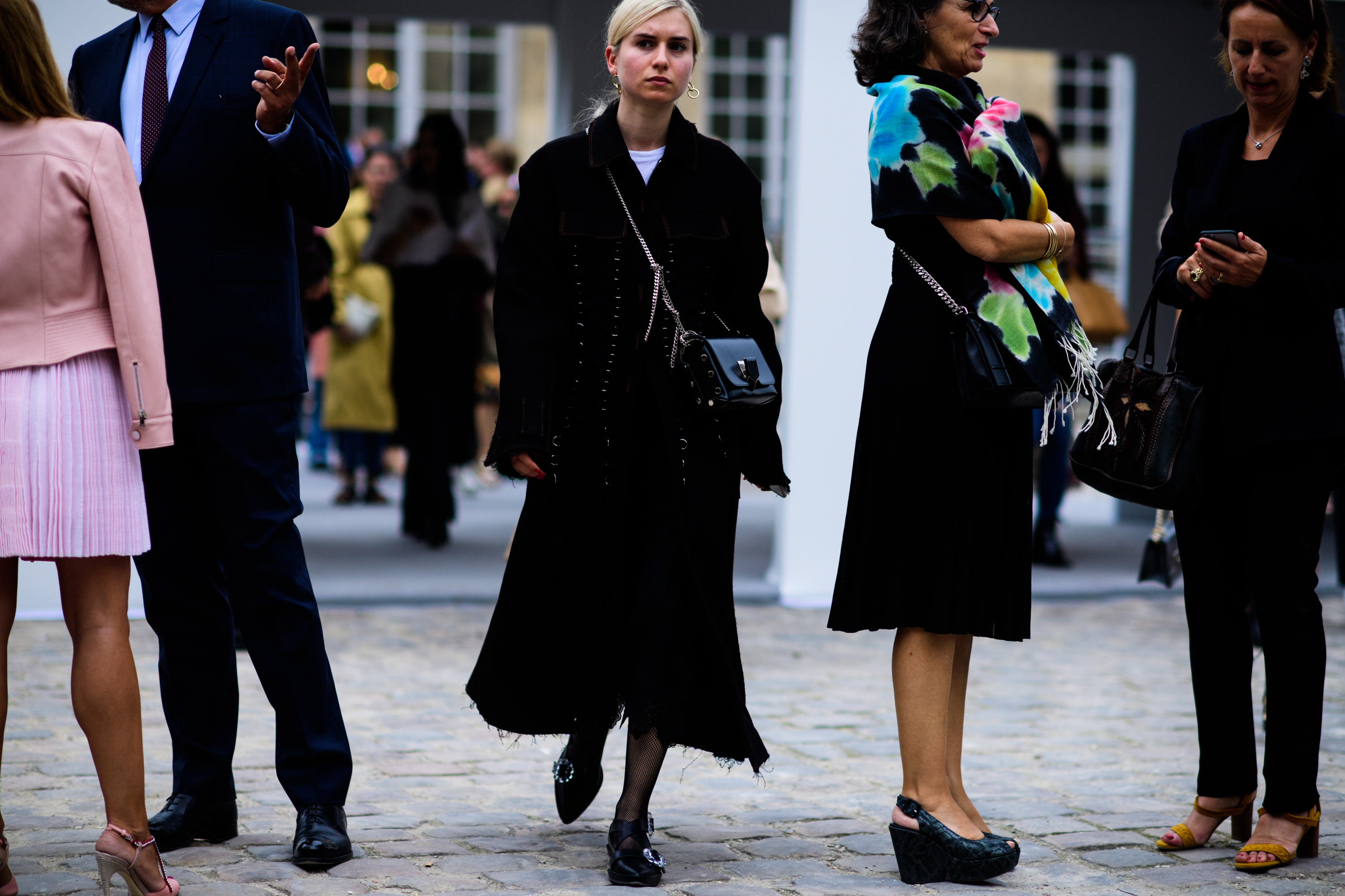 British editor wearing black outfit with silver details