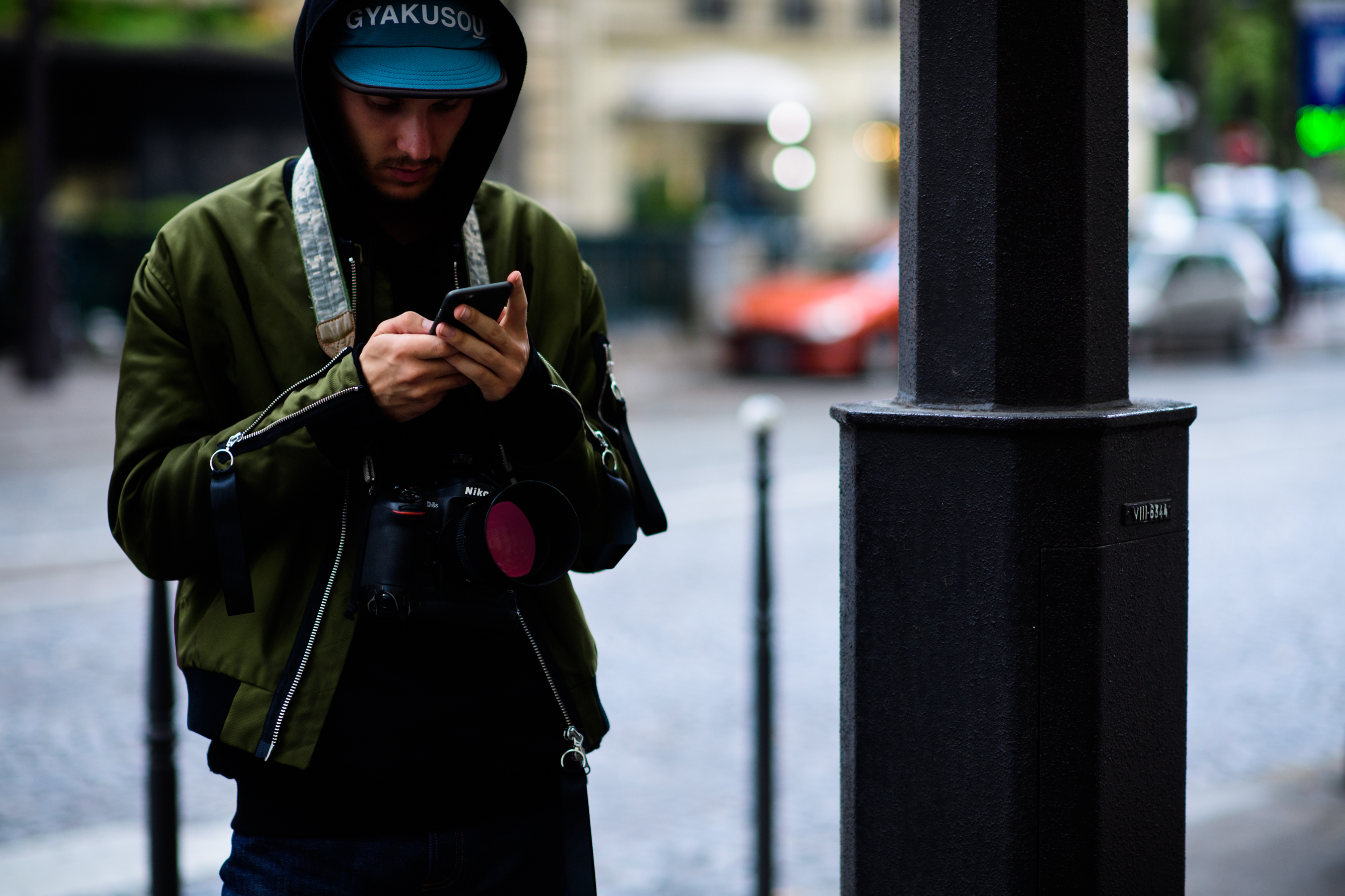 British photographer wearing green bomber jacket