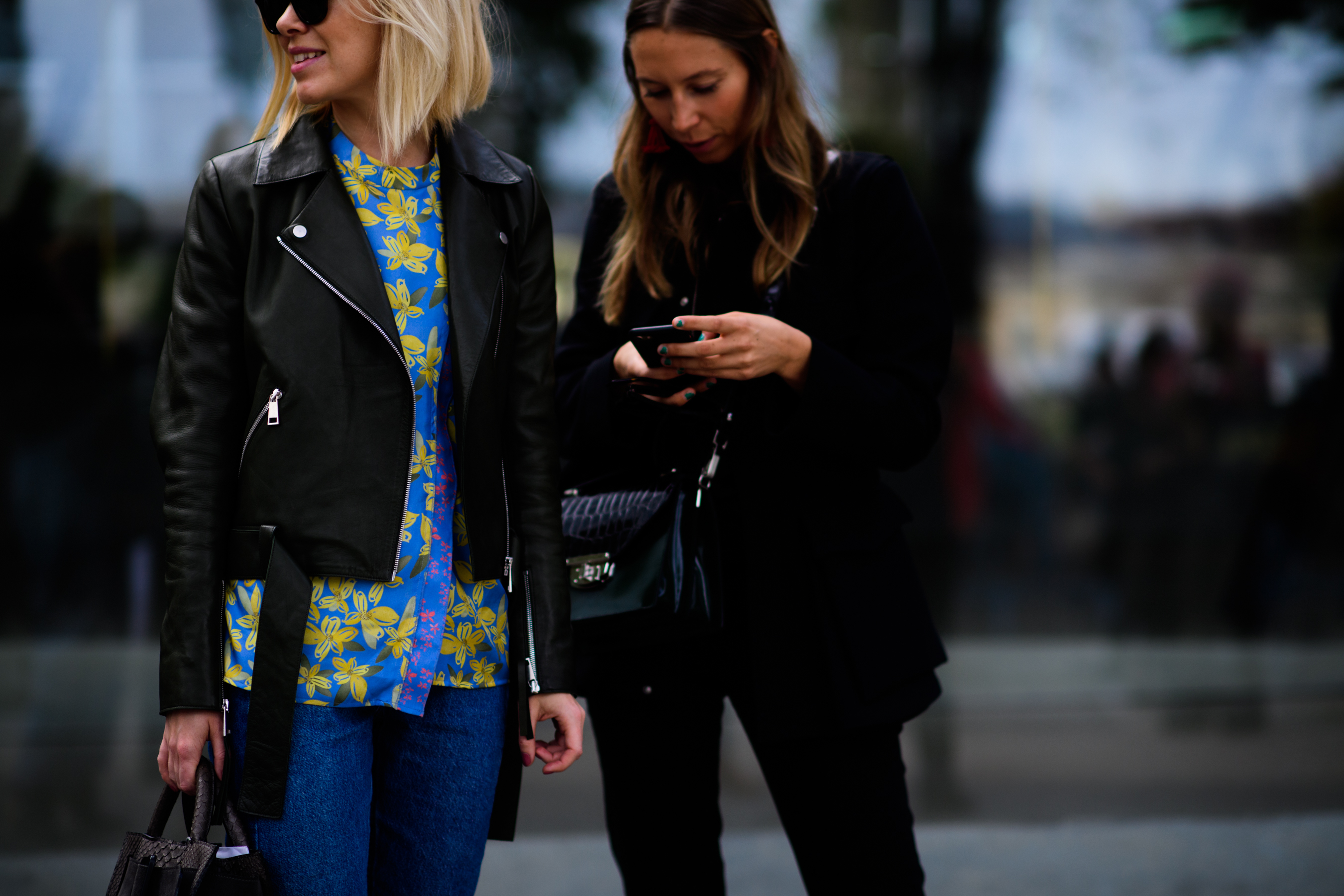 Two women wearing dark jackets