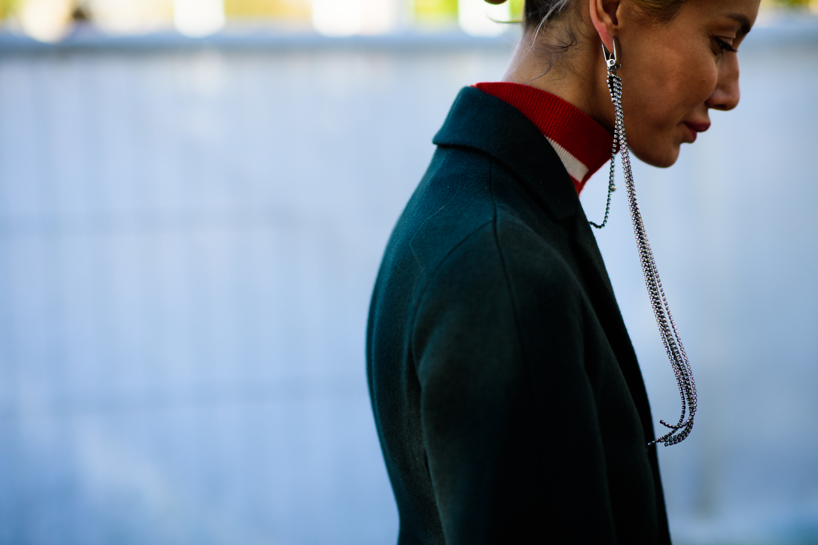 Woman wearing long silver earring