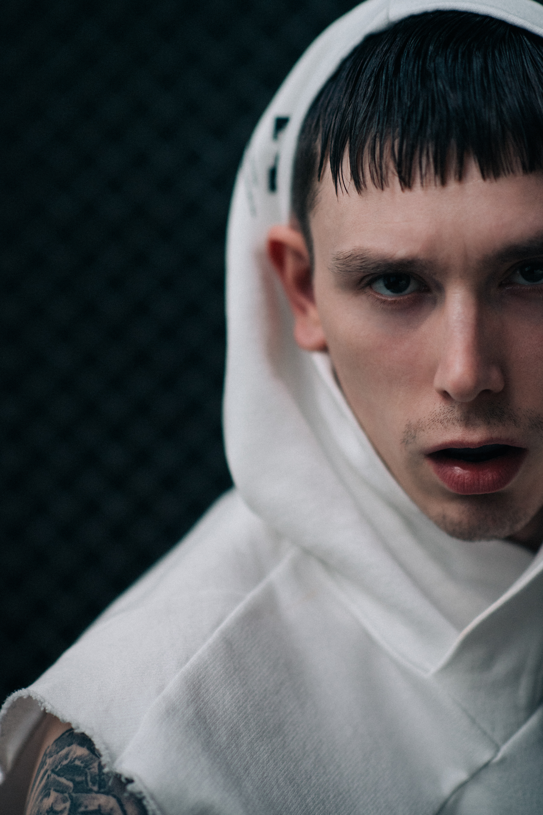 Male model wearing white hoodie