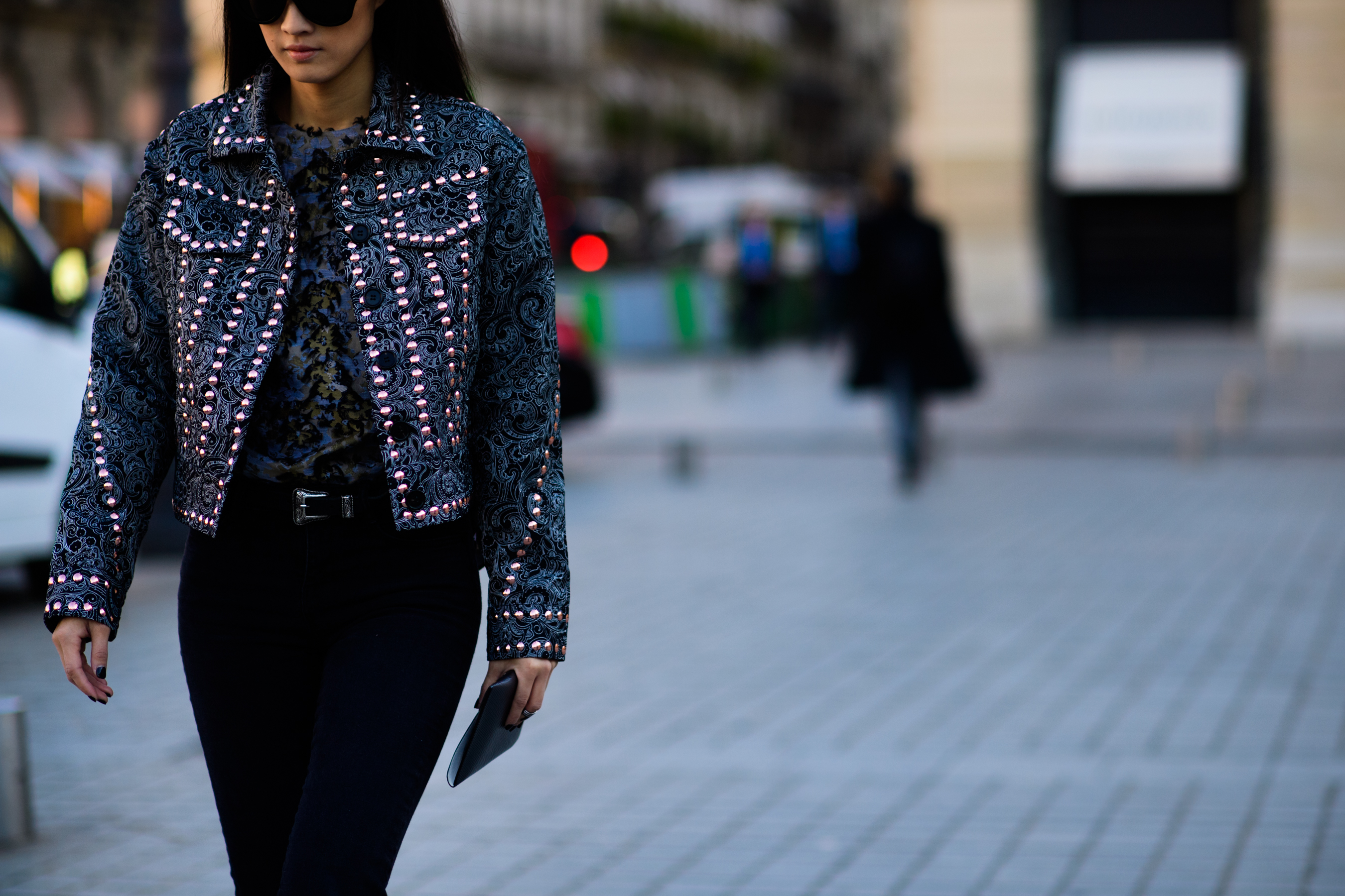 Woman wearing studded denim jacket