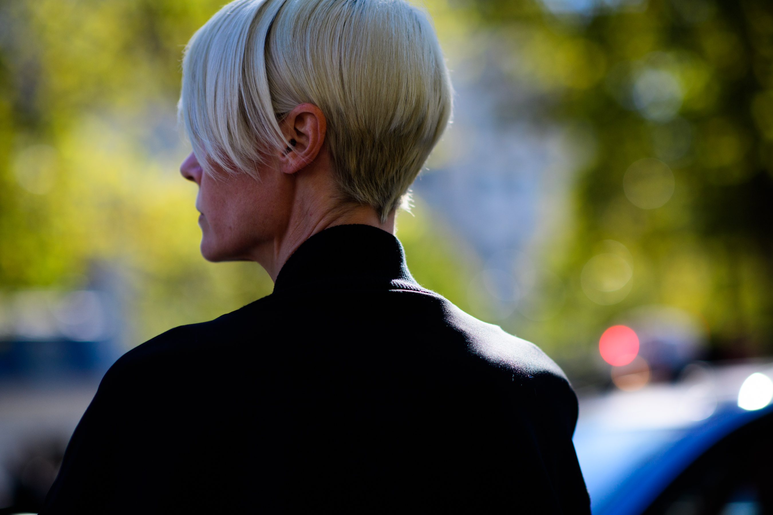 Woman from side with cropped grey hair