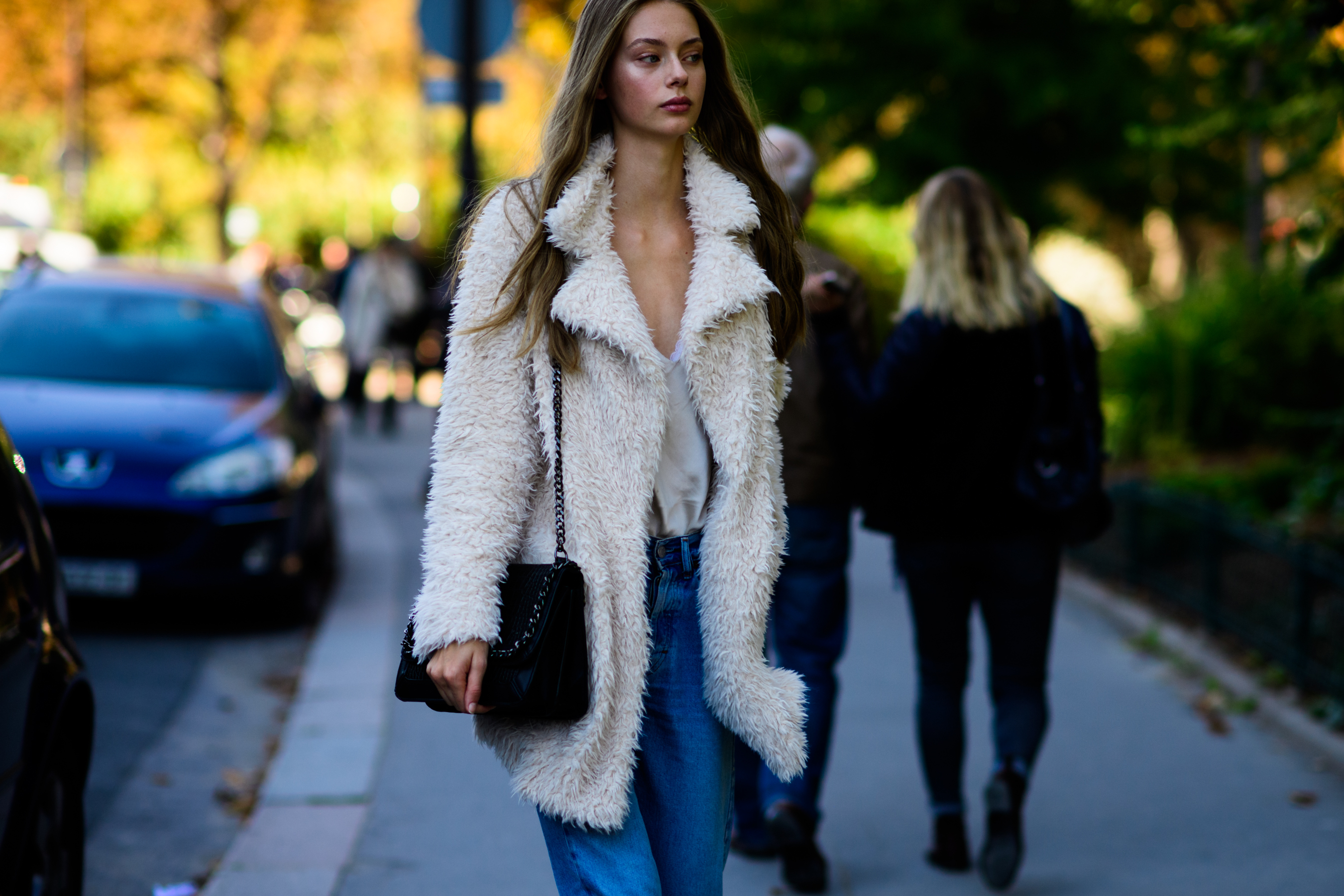 Dutch model walking in white coat