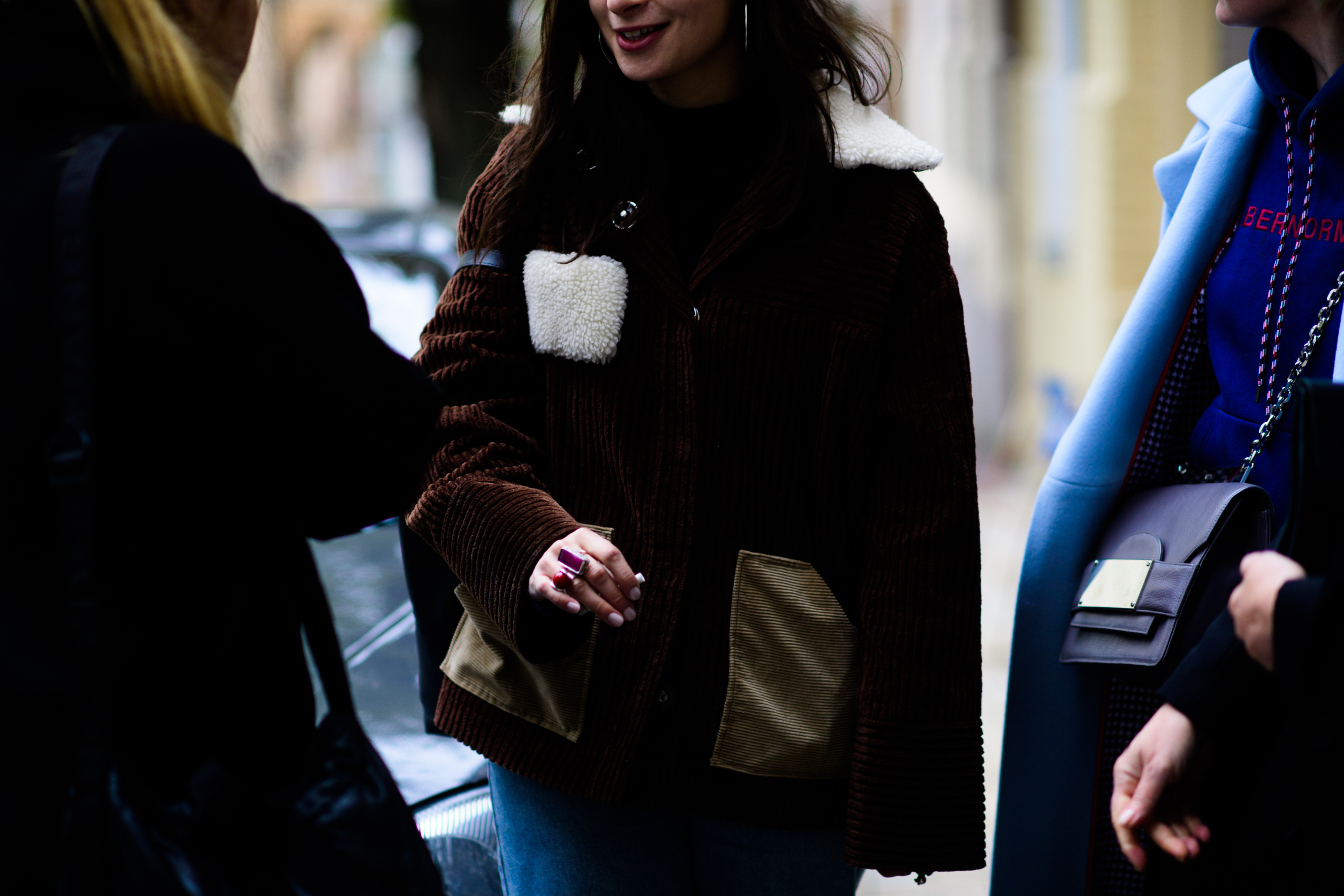 American journalist wearing brown jacket