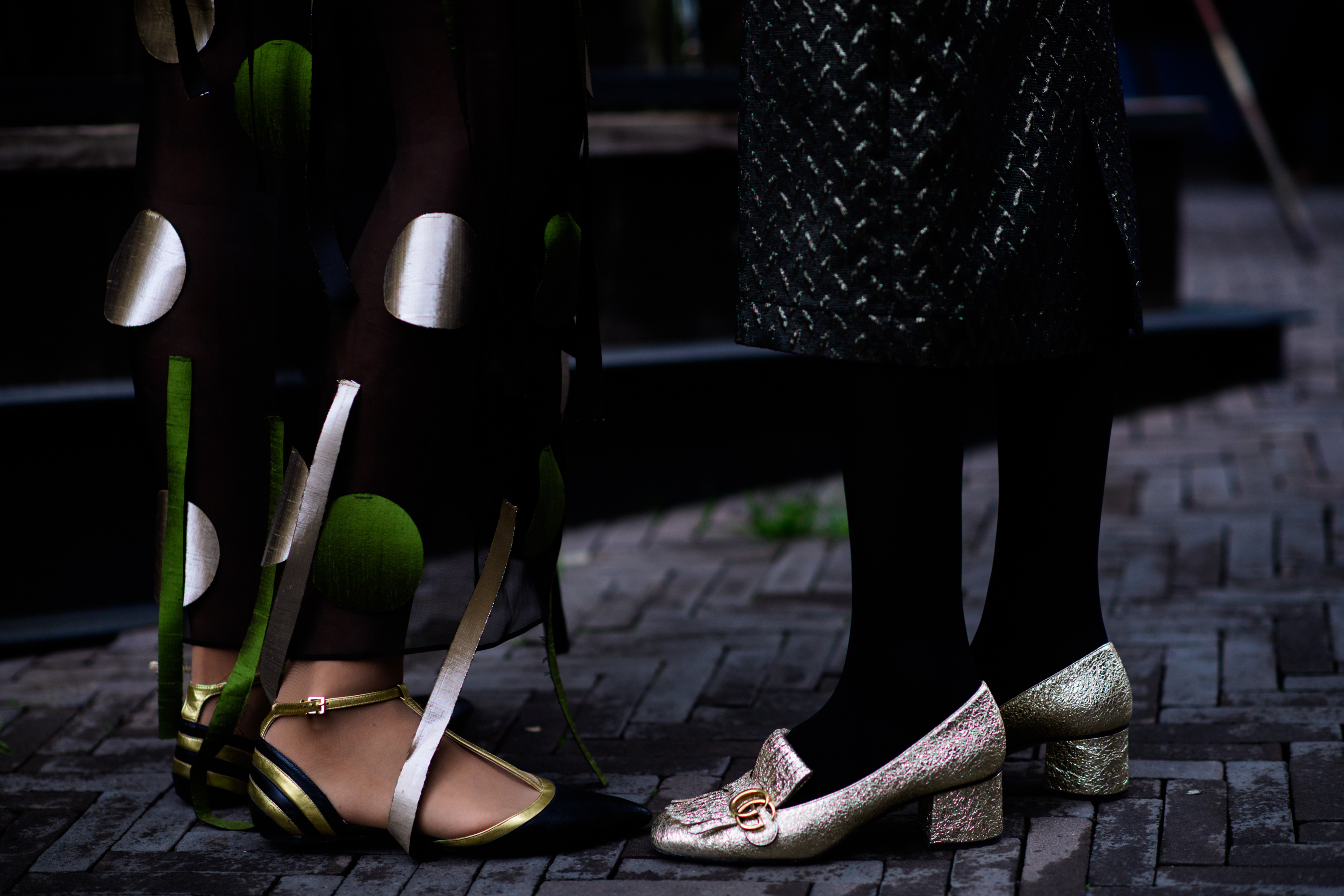 Two Georgian woman wearing golden shoes