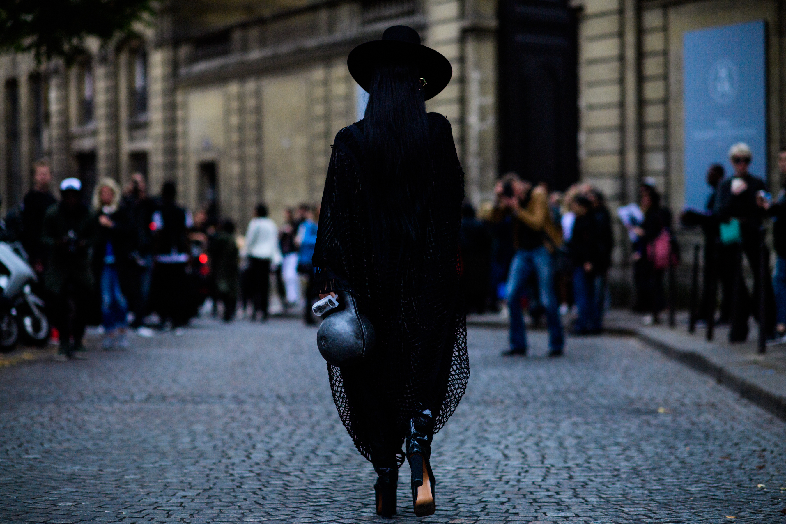 Back of woman wearing all black outfit