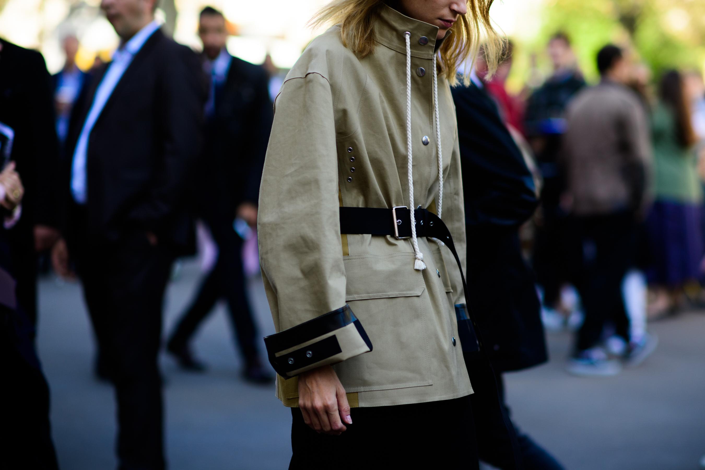 Woman wearing light raincoat