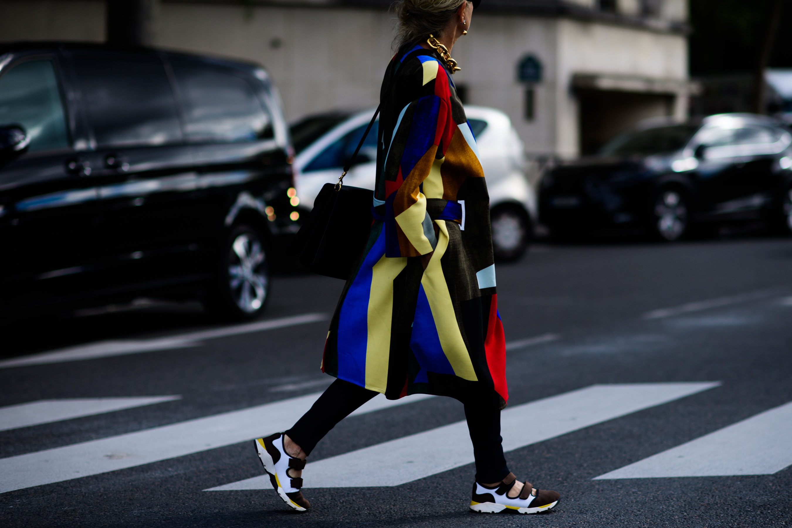 British fashion director wearing multicoloured coat