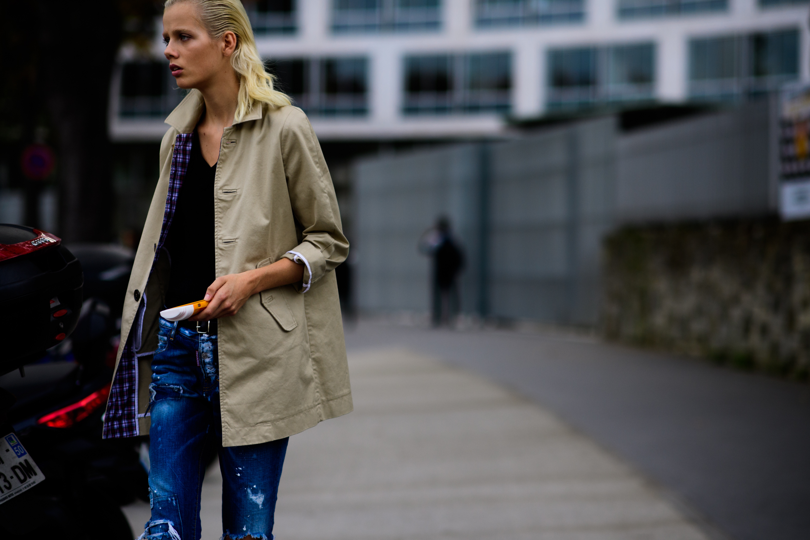 Dutch model walking on phone with long coat