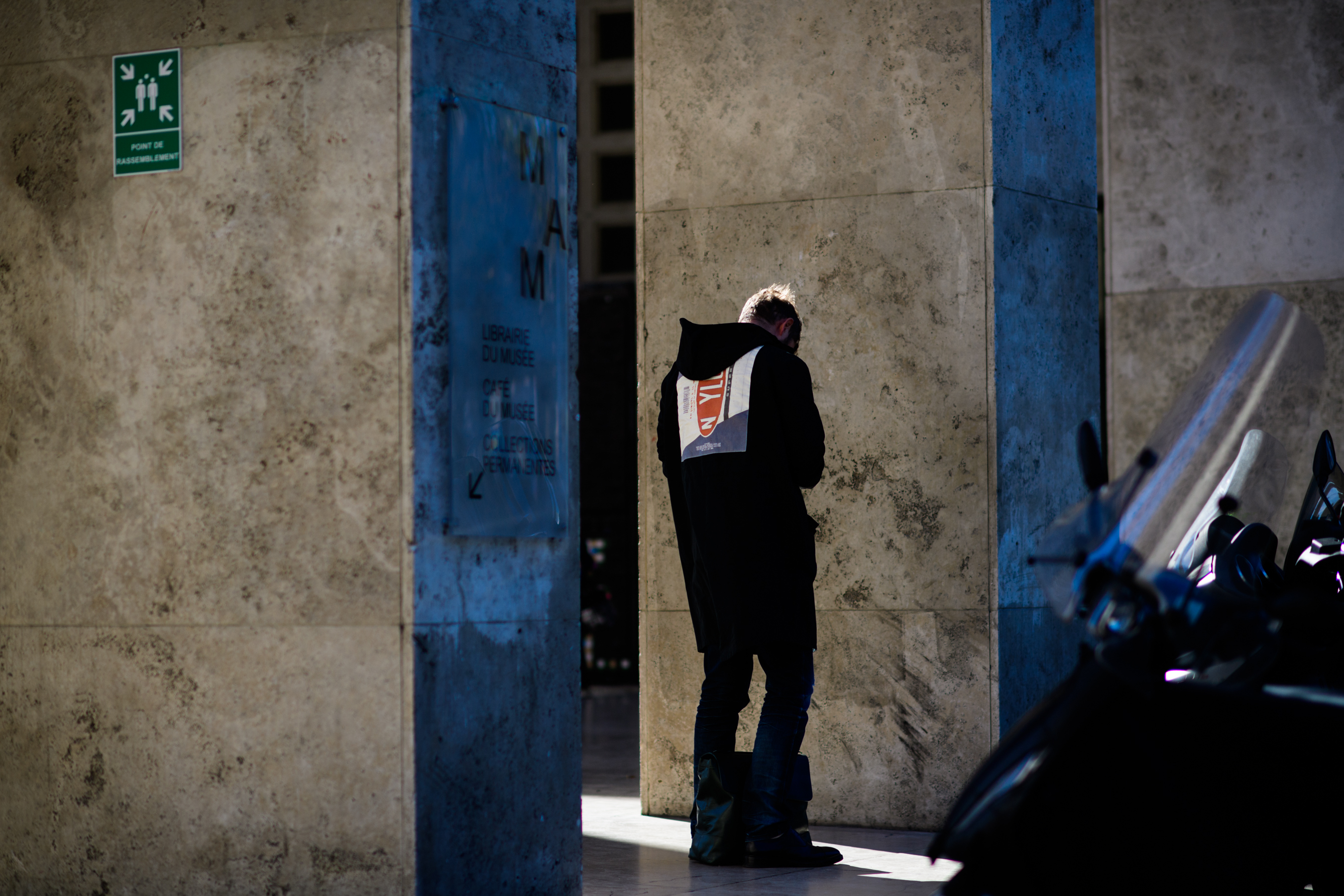 Man wearing coat with rear graphic