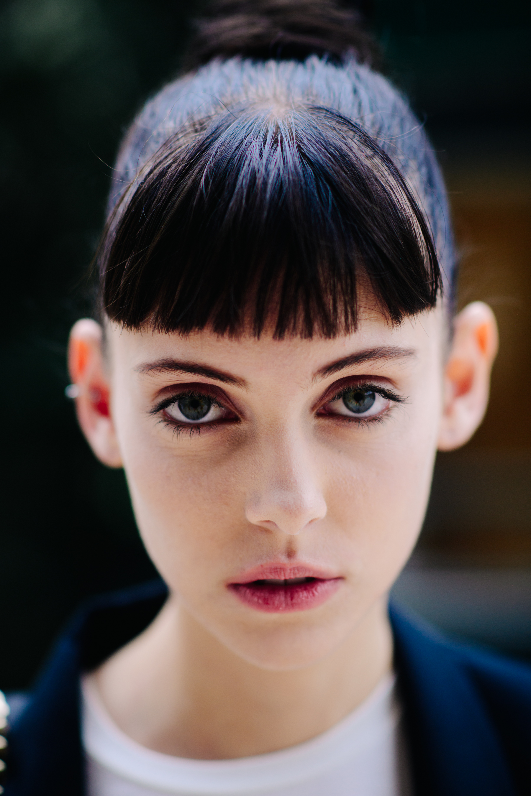 Portrait of Australian model with short fringe and green eyes