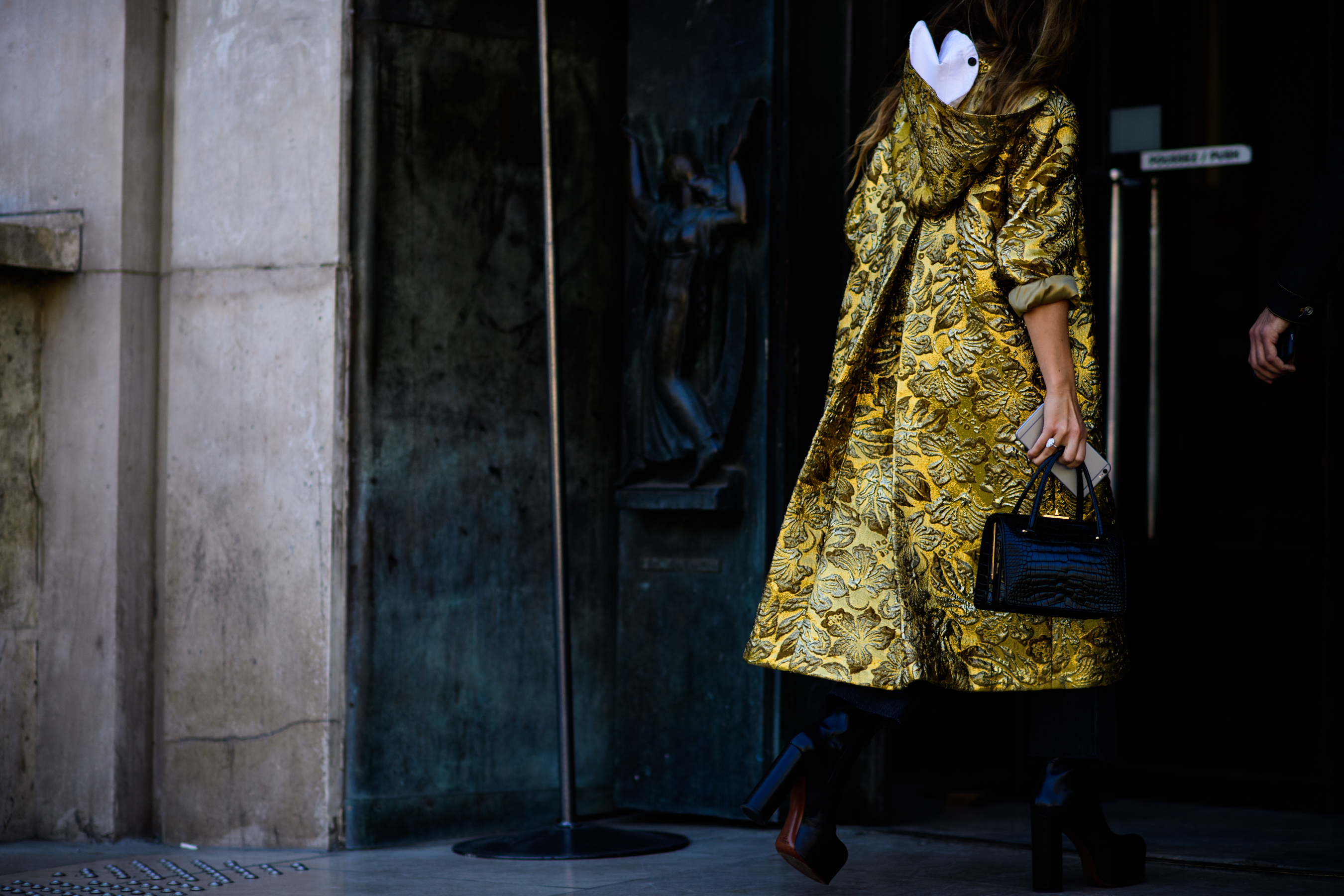 Editor wearing gold floral coat