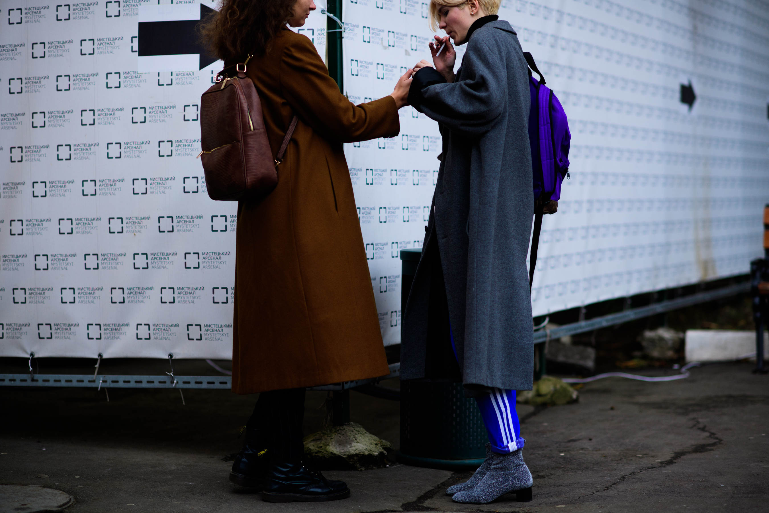 Two women smoking after the show