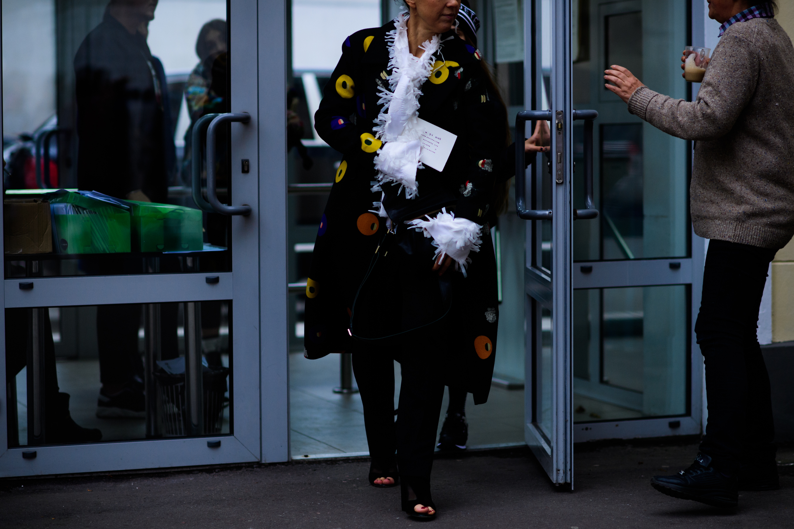 Woman wearing Poustovit coat