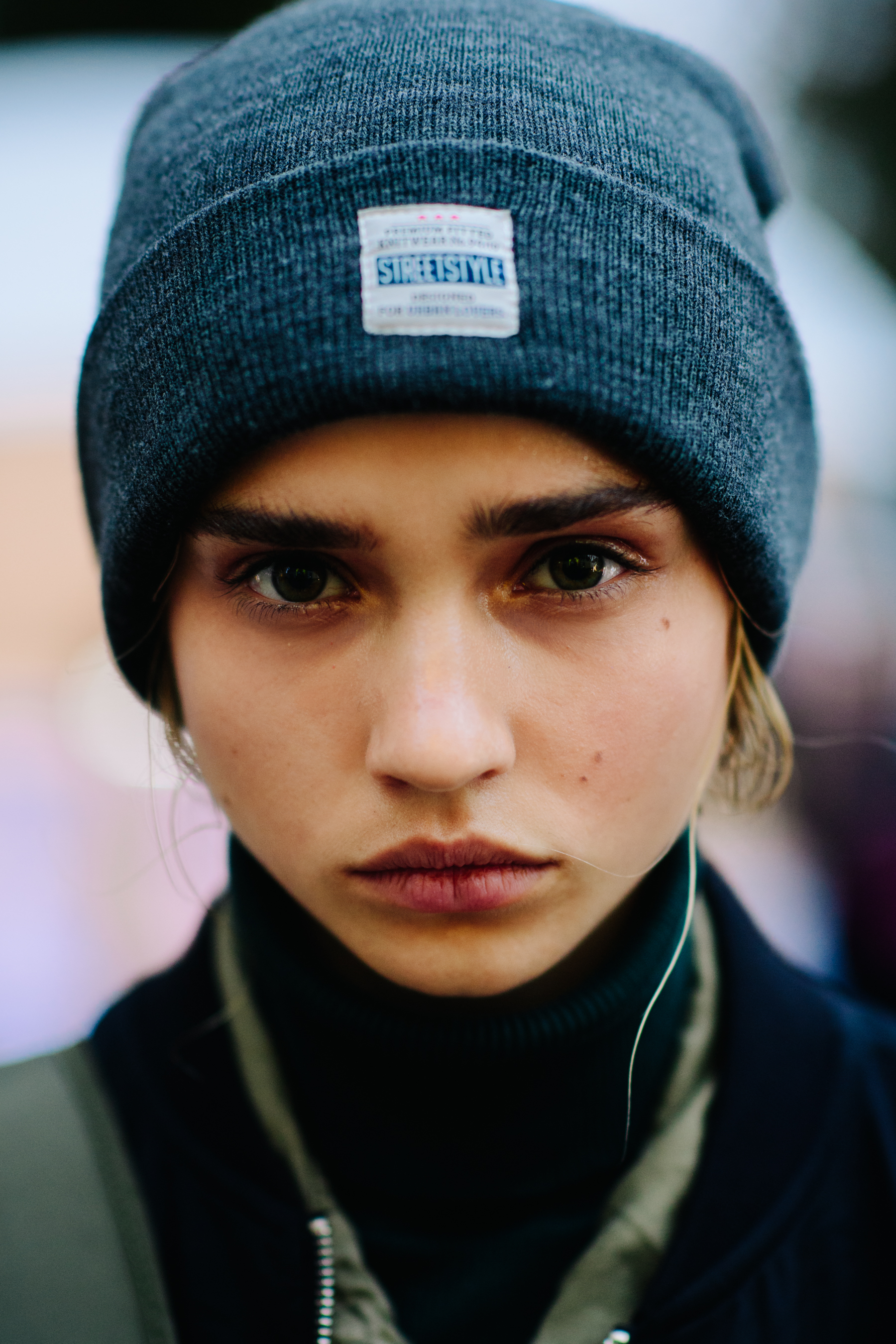 Portrait of a model wearing grey hat