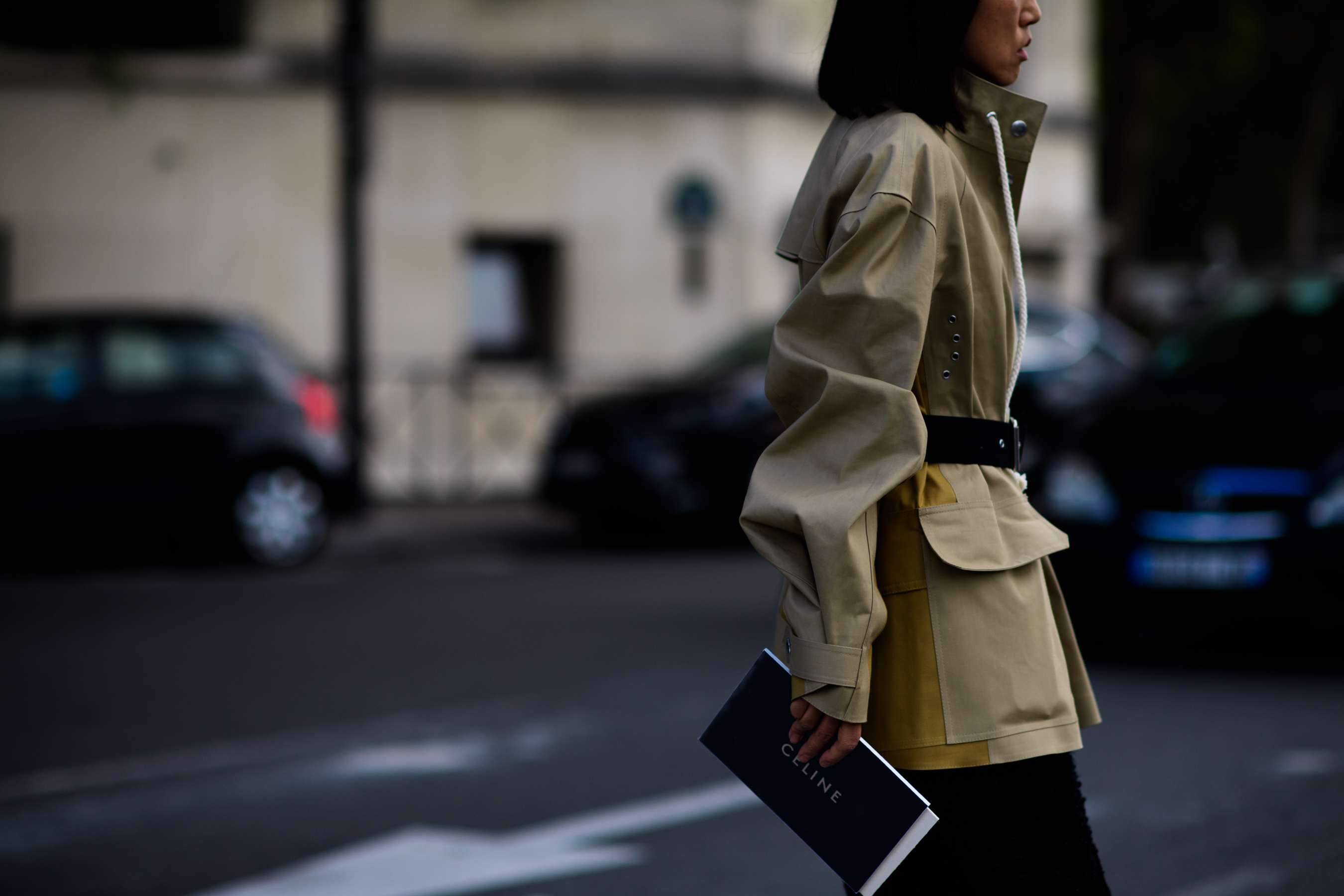 Japanese woman in camel coat with white