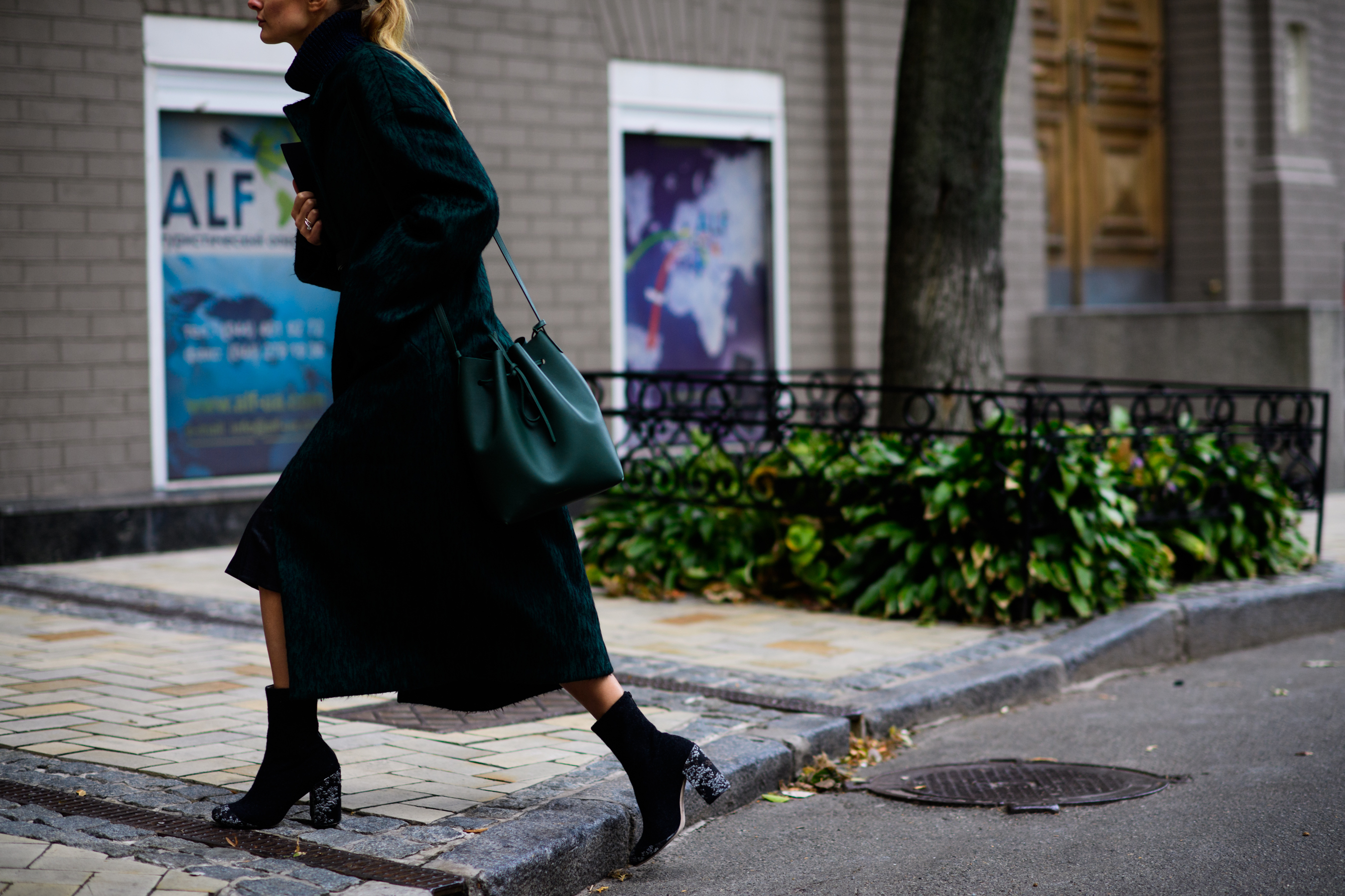 Woman with green shoulder bag