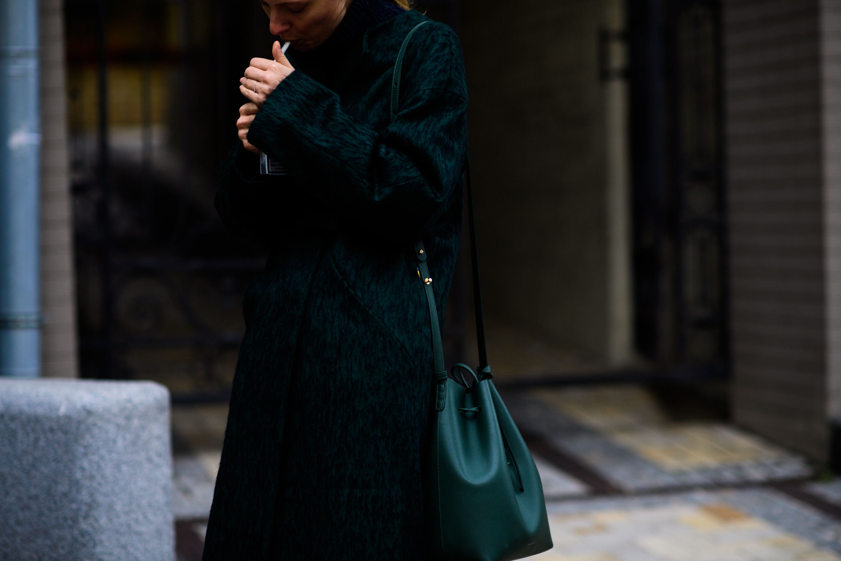 Woman with green shoulder bag