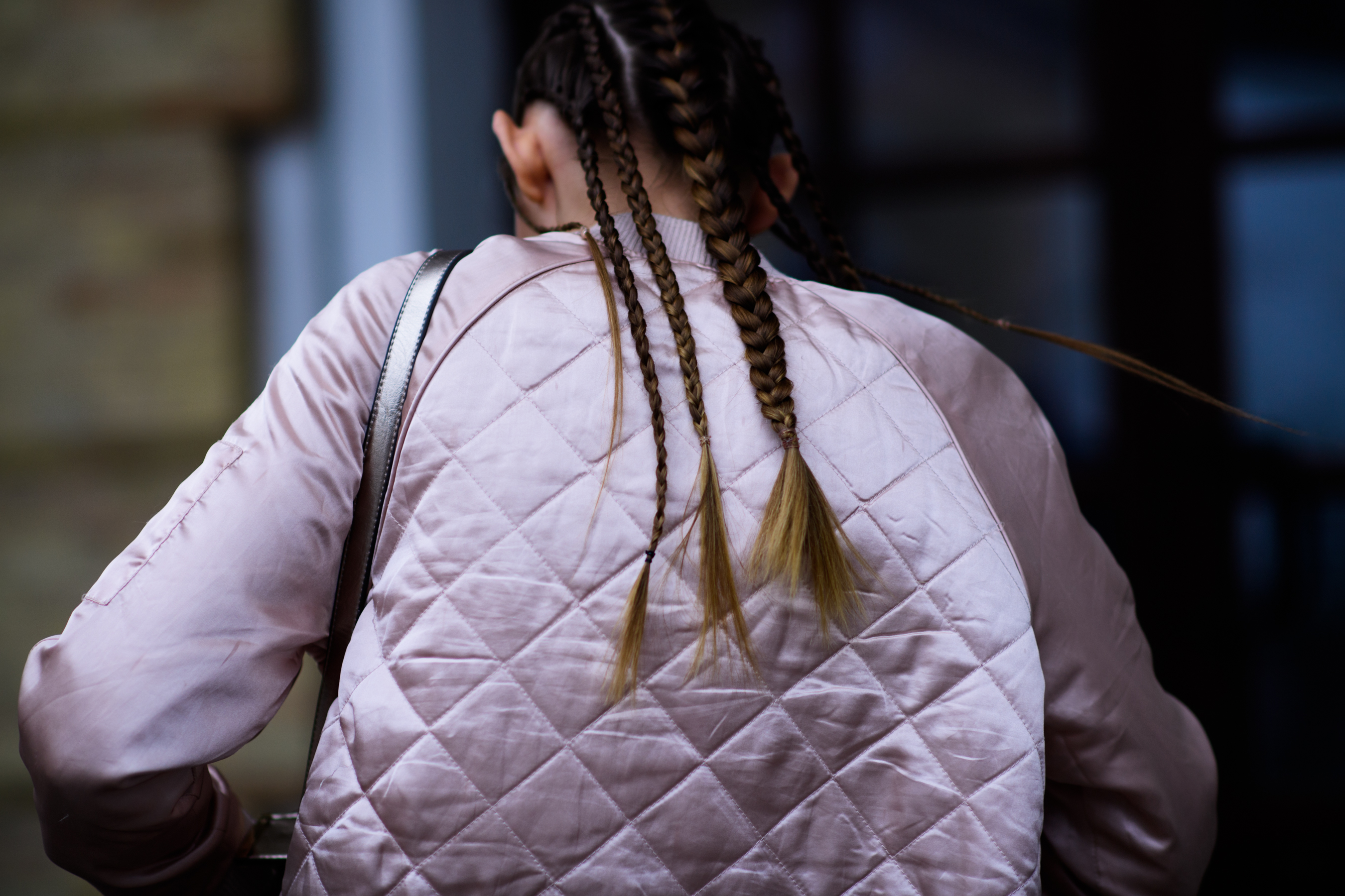 Girl wearing pink shiny bomber