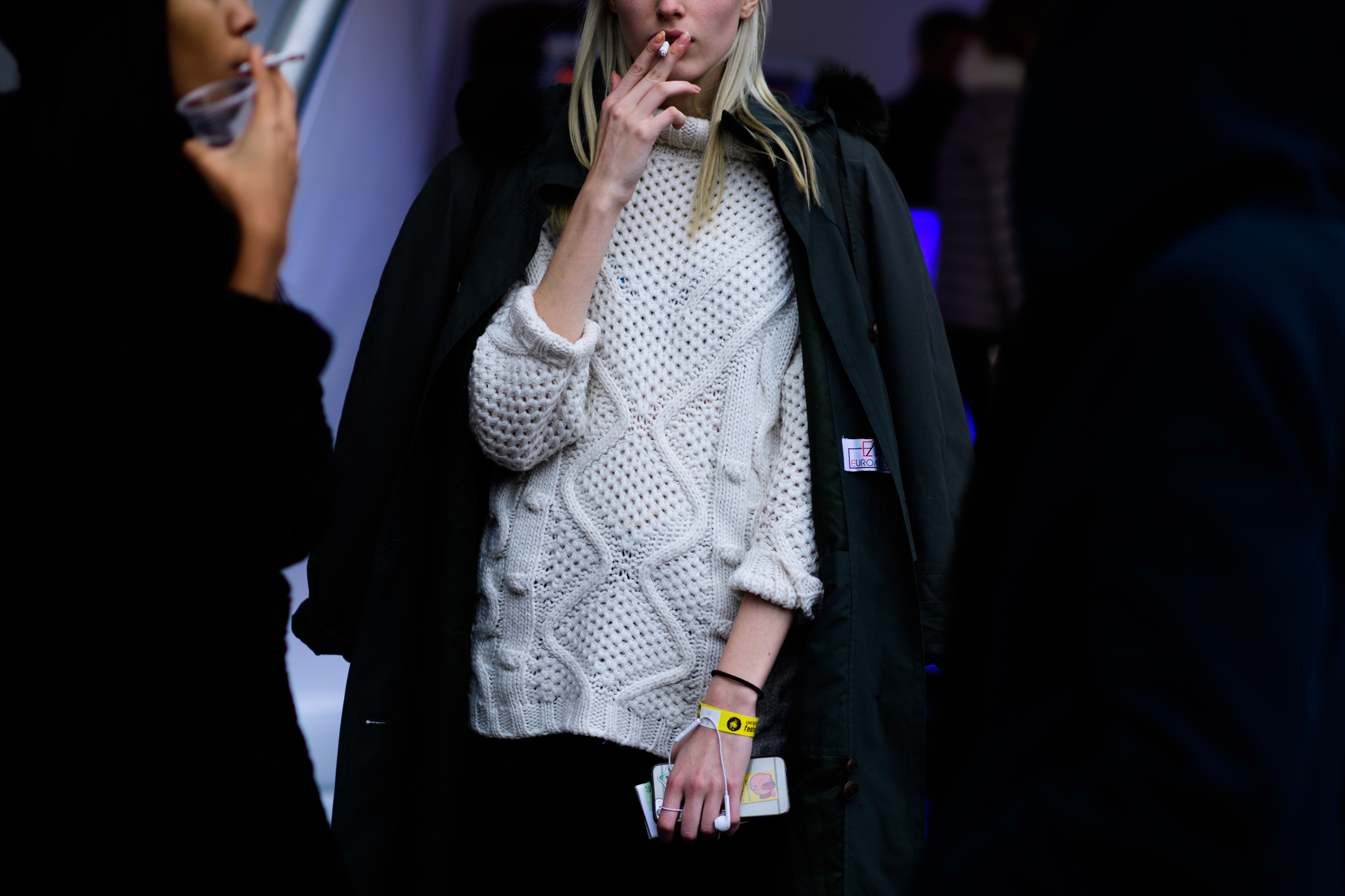 Woman wearing white sweater