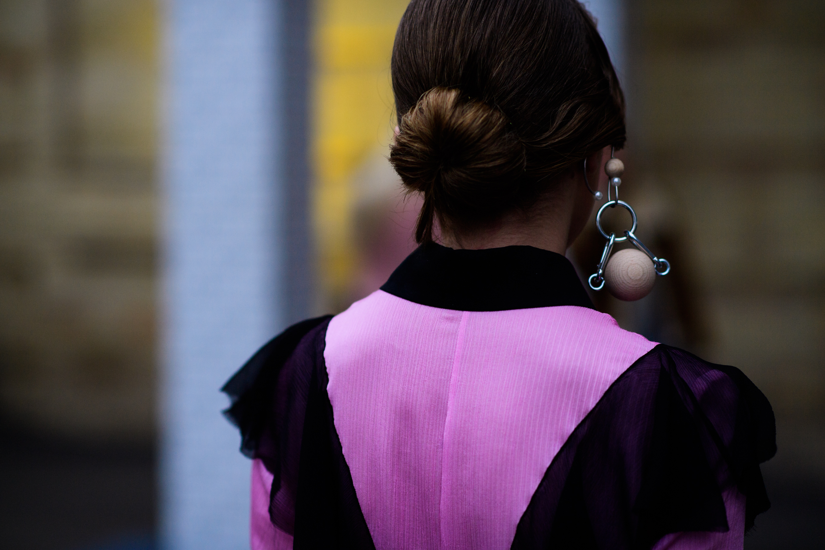 Woman wearing oversized wooden earring