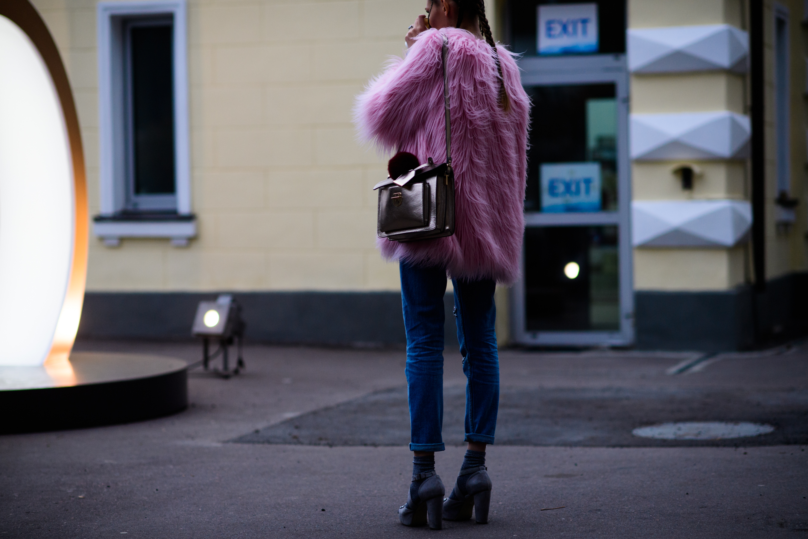 Girl wearing pink faux fur coat