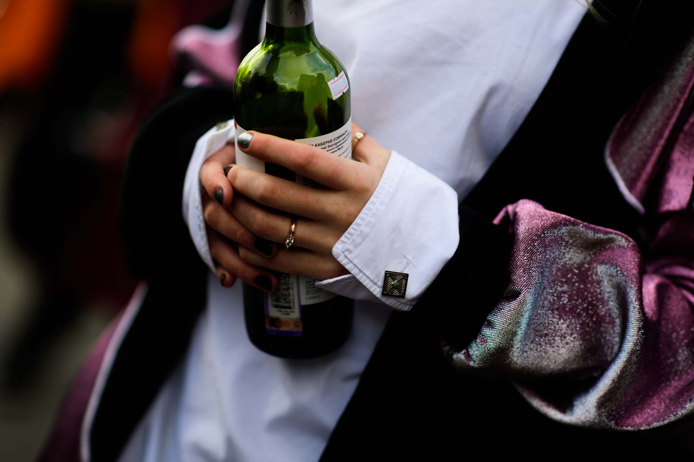 Russian girl holding bottle of wine