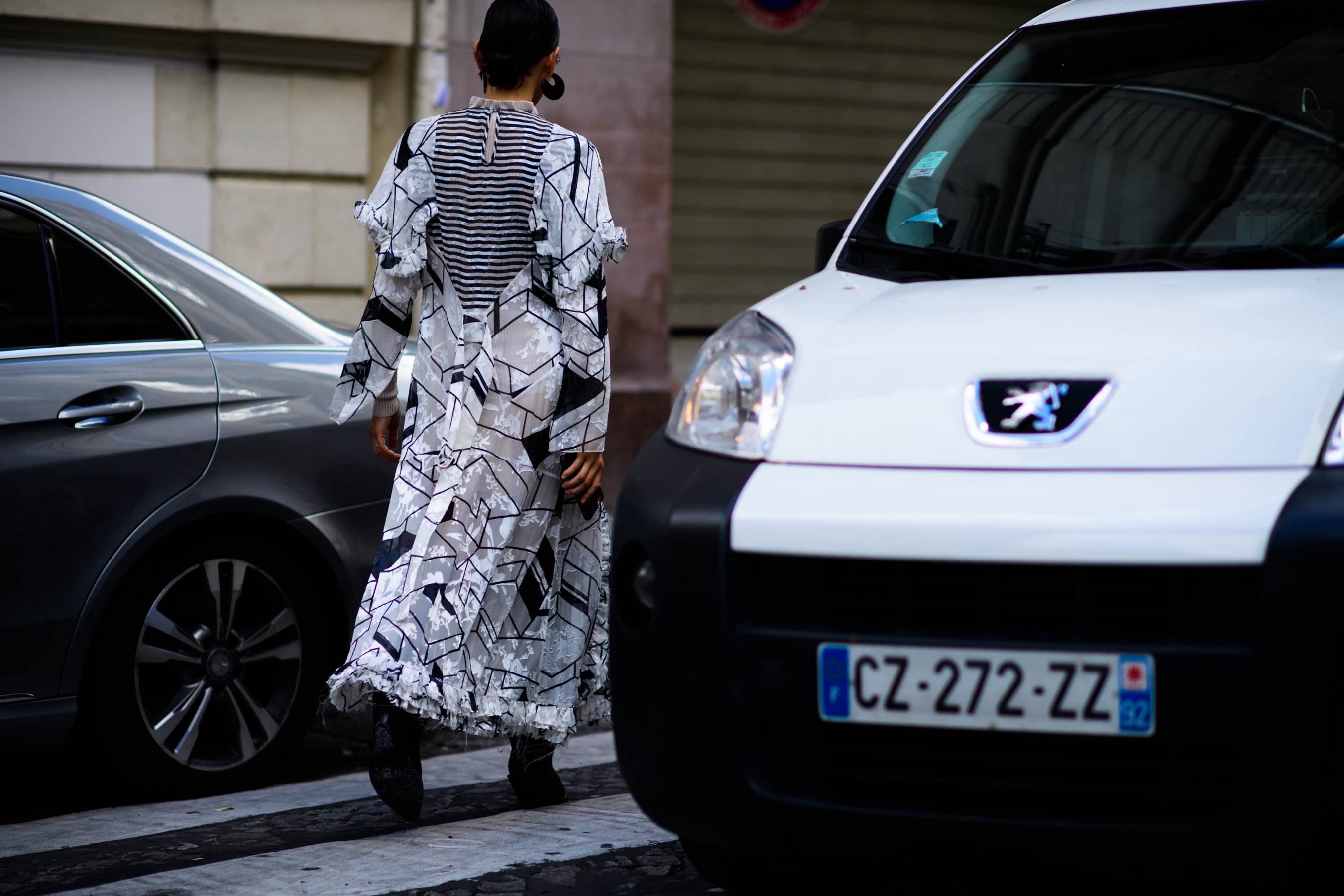 Stylist wearing white and black pattern dress