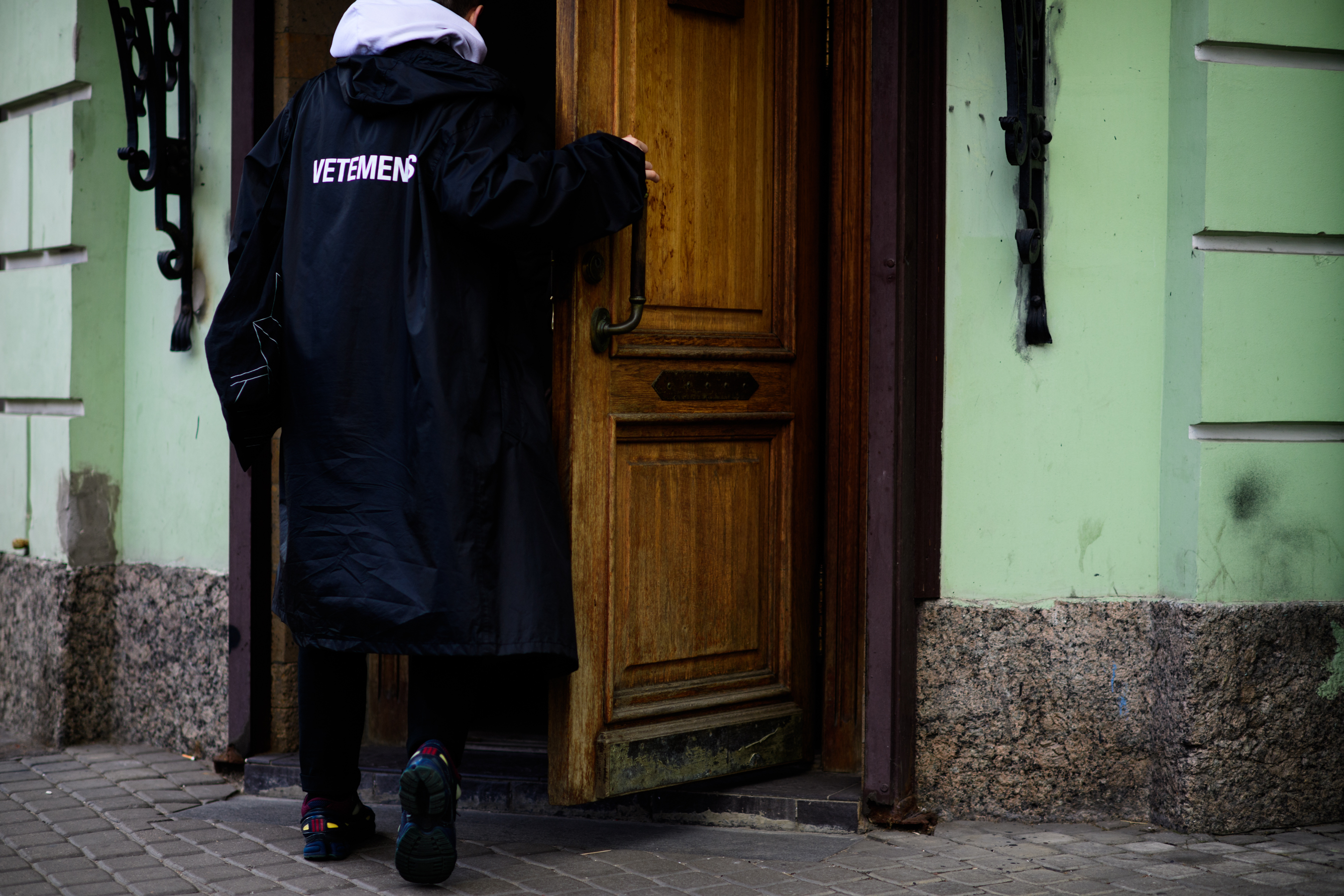 Russian man wearing Vetements rain coat