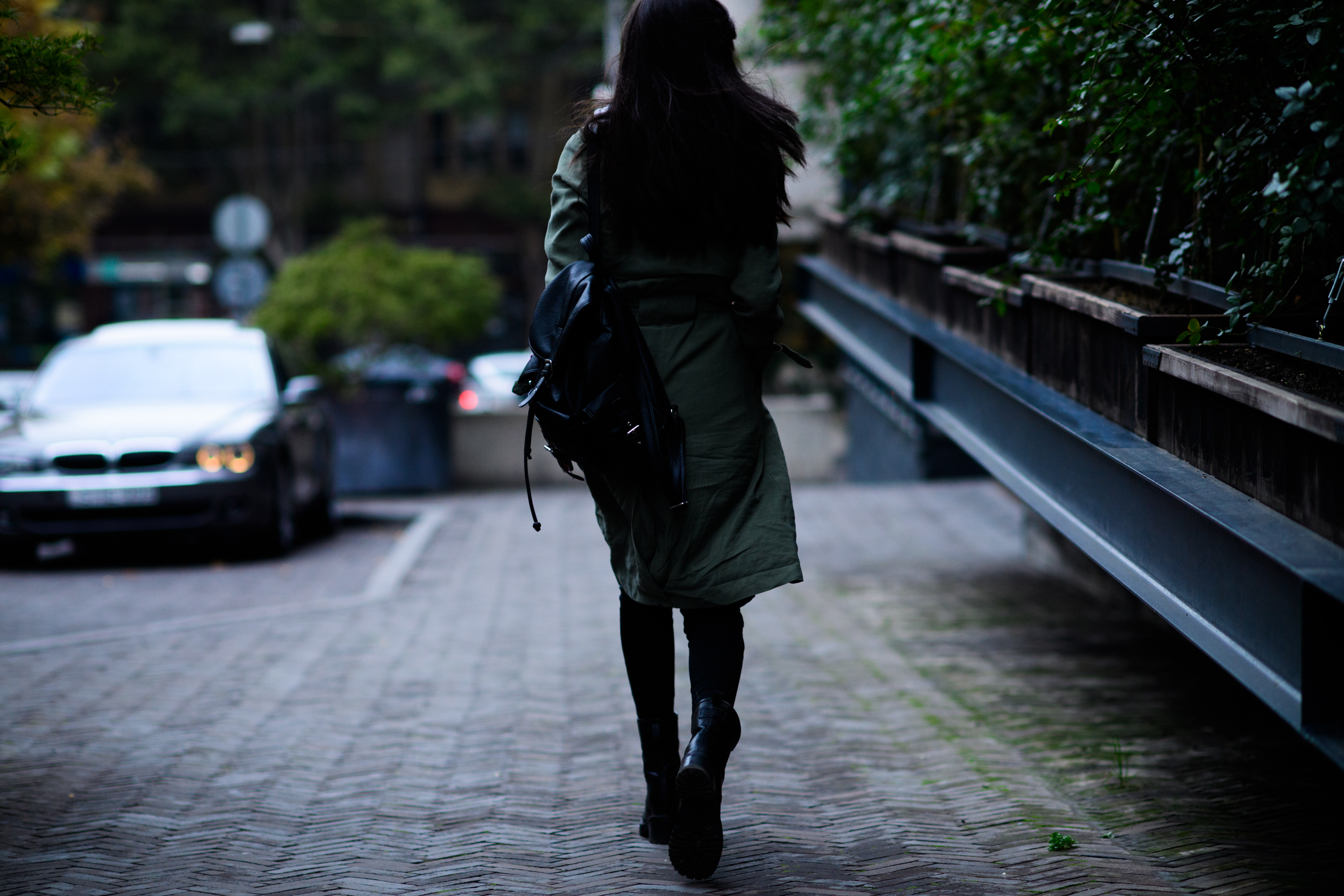 Model wearing dark green trench