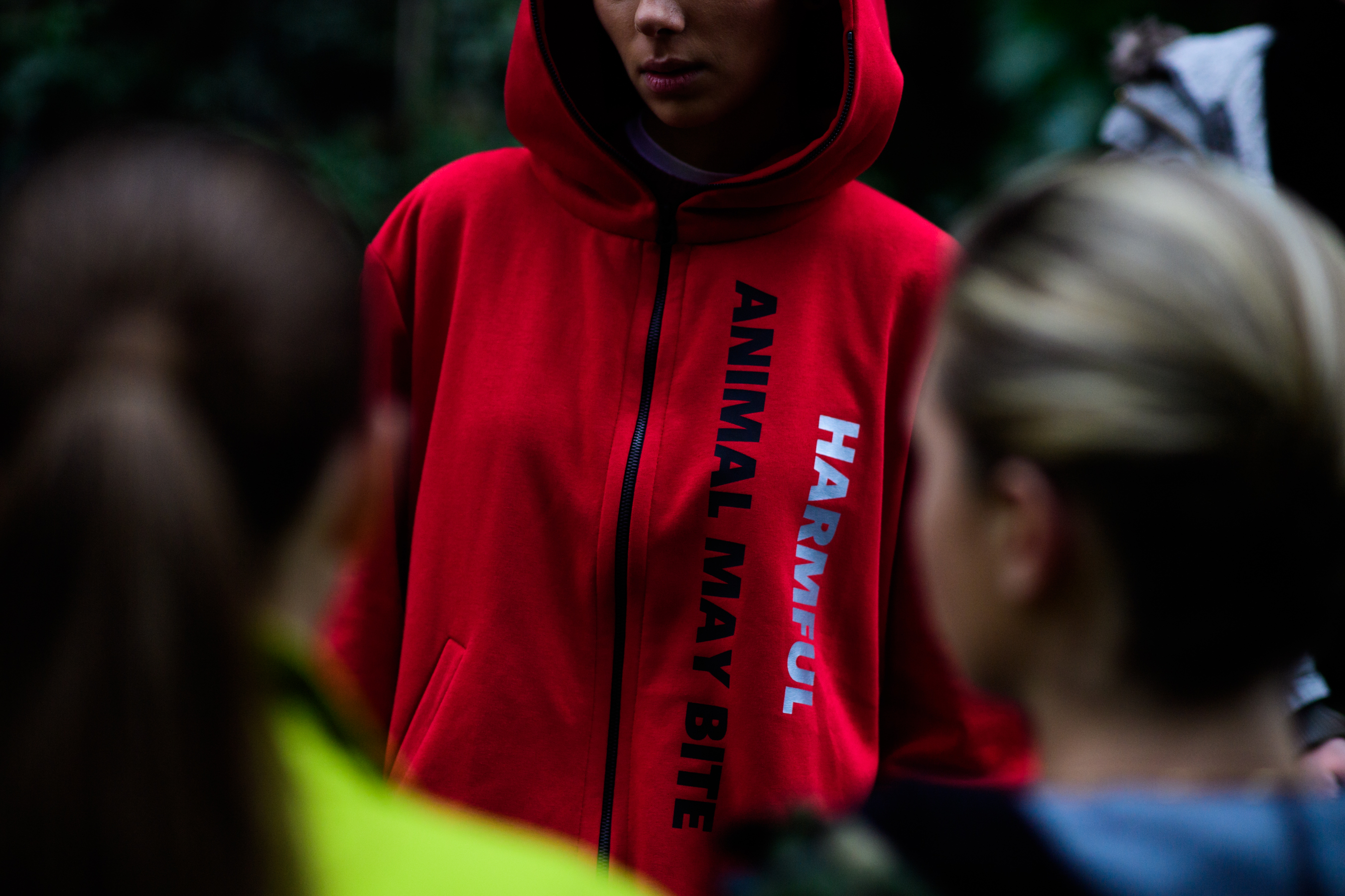 Model wearing red hoodie