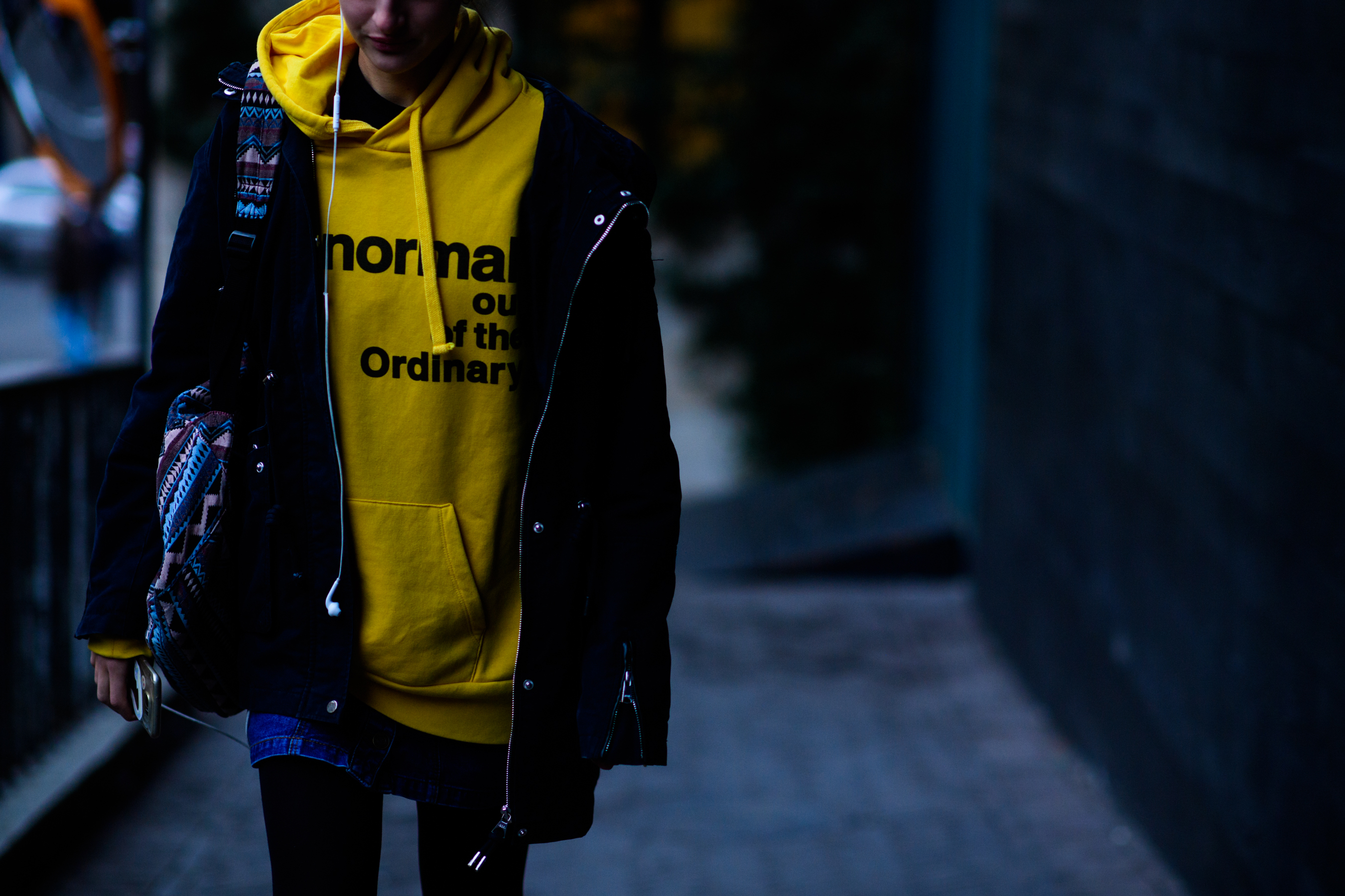 Model wearing yellow hoodie