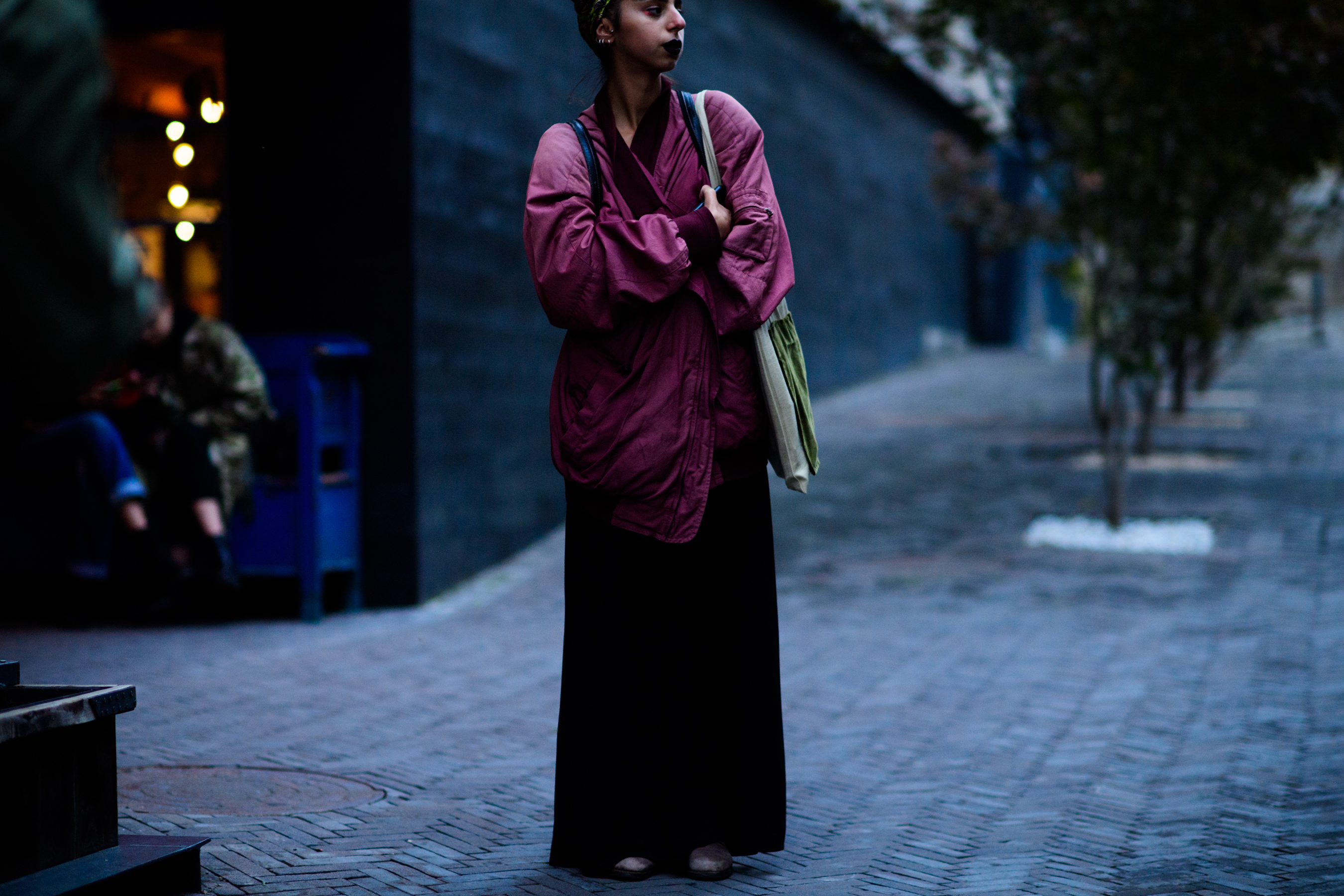 Woman wearing pink bomber jacket