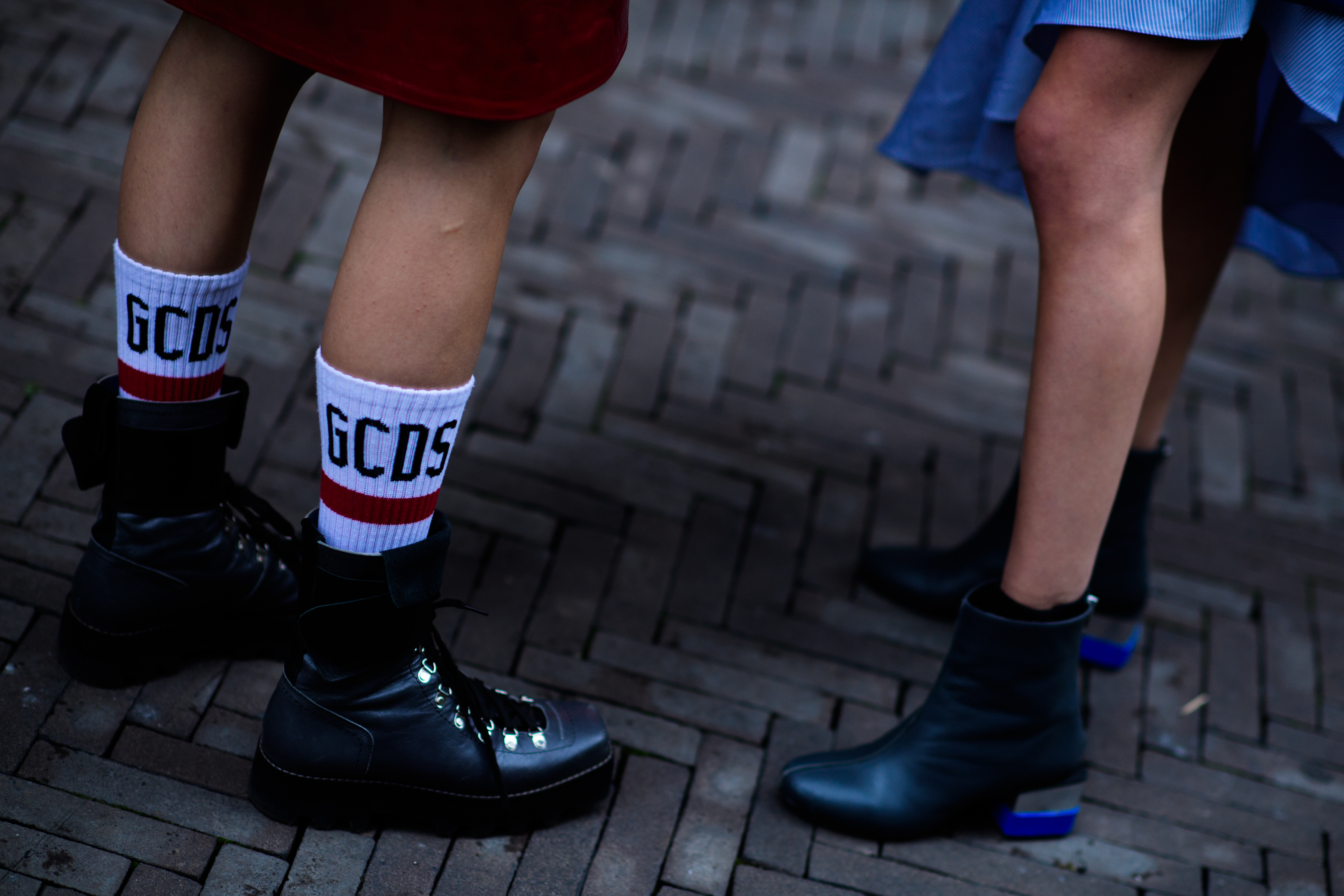 Two models wearing boots