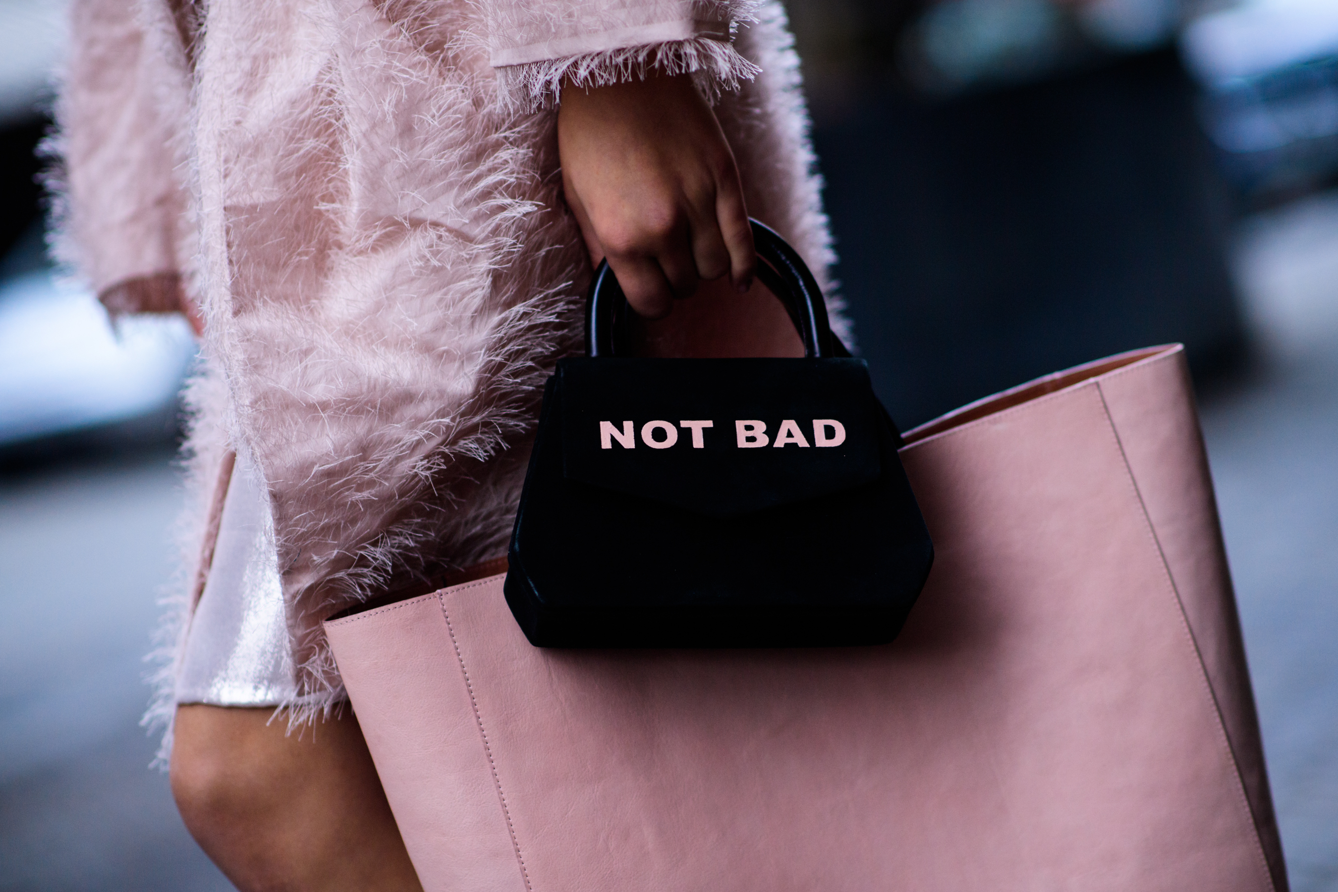 Woman holding two bags