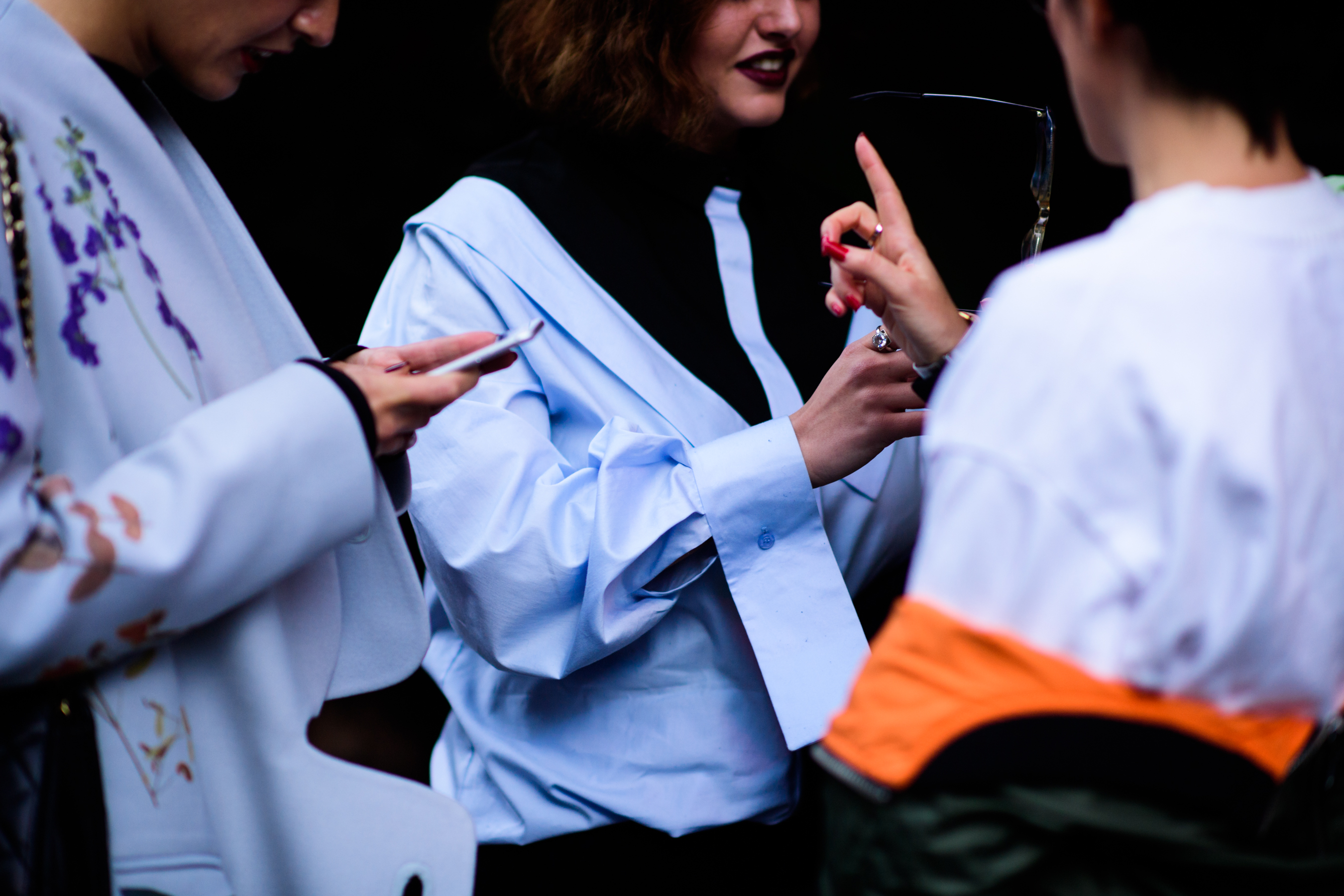 Georgian PR director wearing blue top