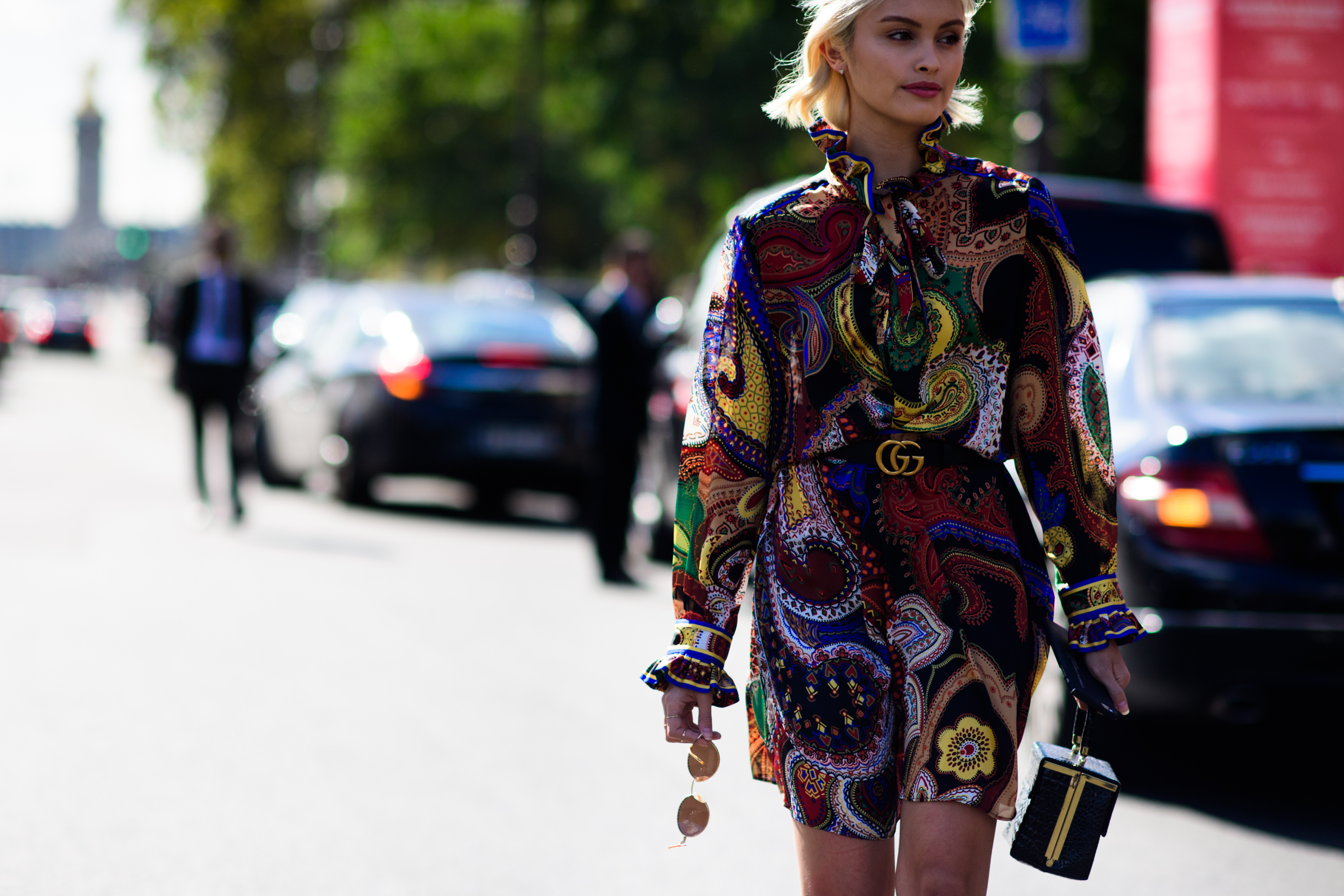 Australian actress wearing pattern dress and gold belt
