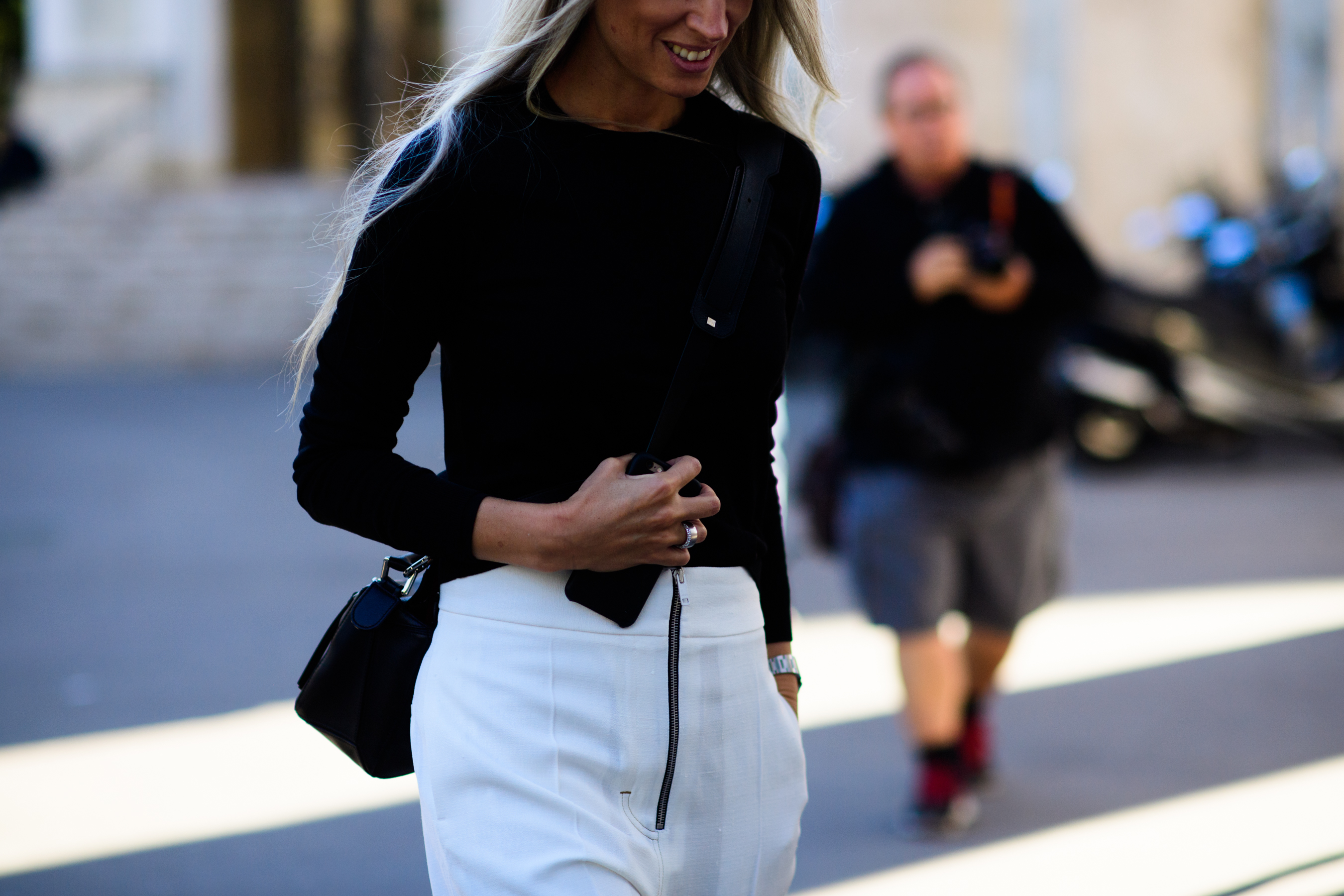 British editor wearing white pants
