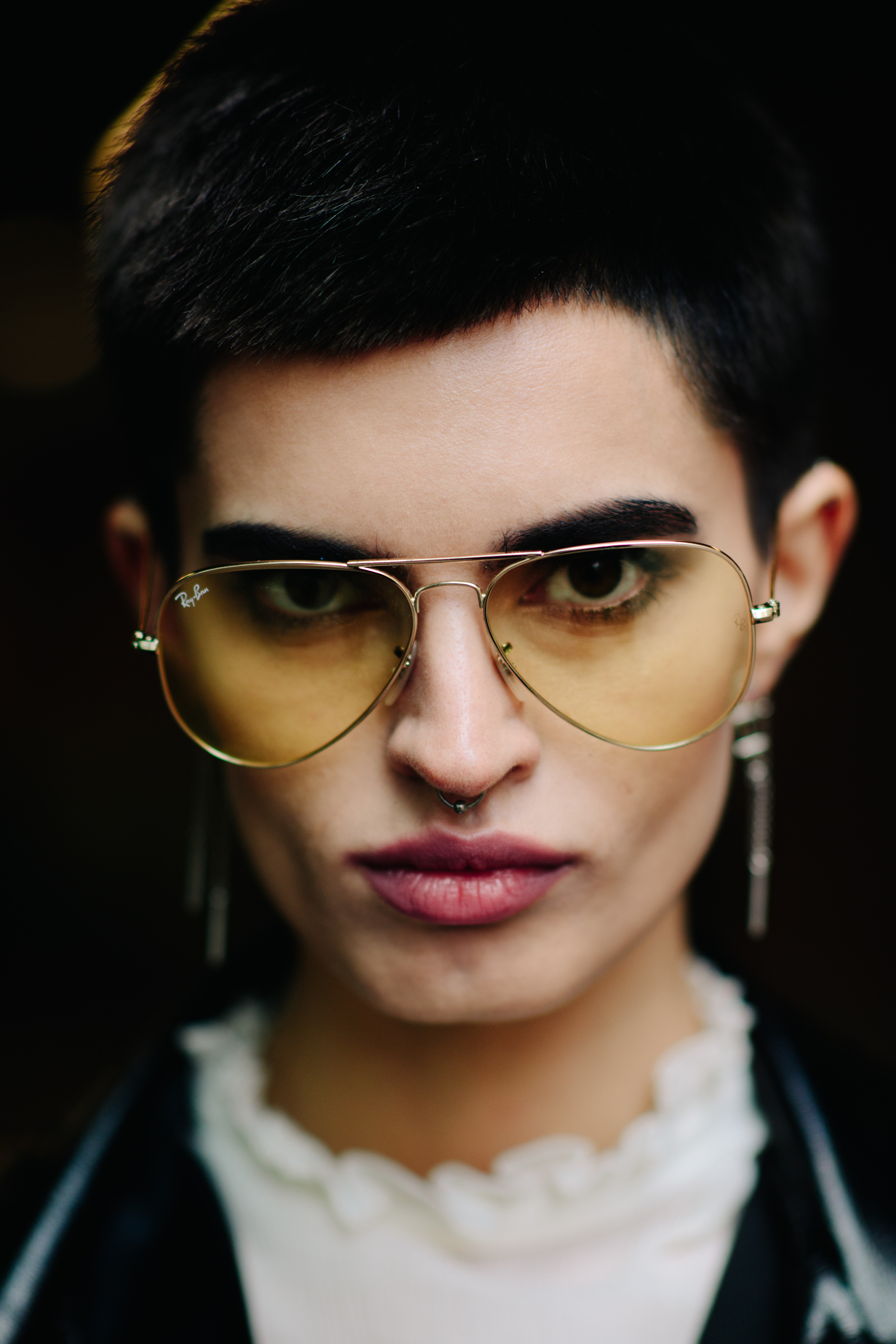Portrait of a Russian model wearing yellow aviators