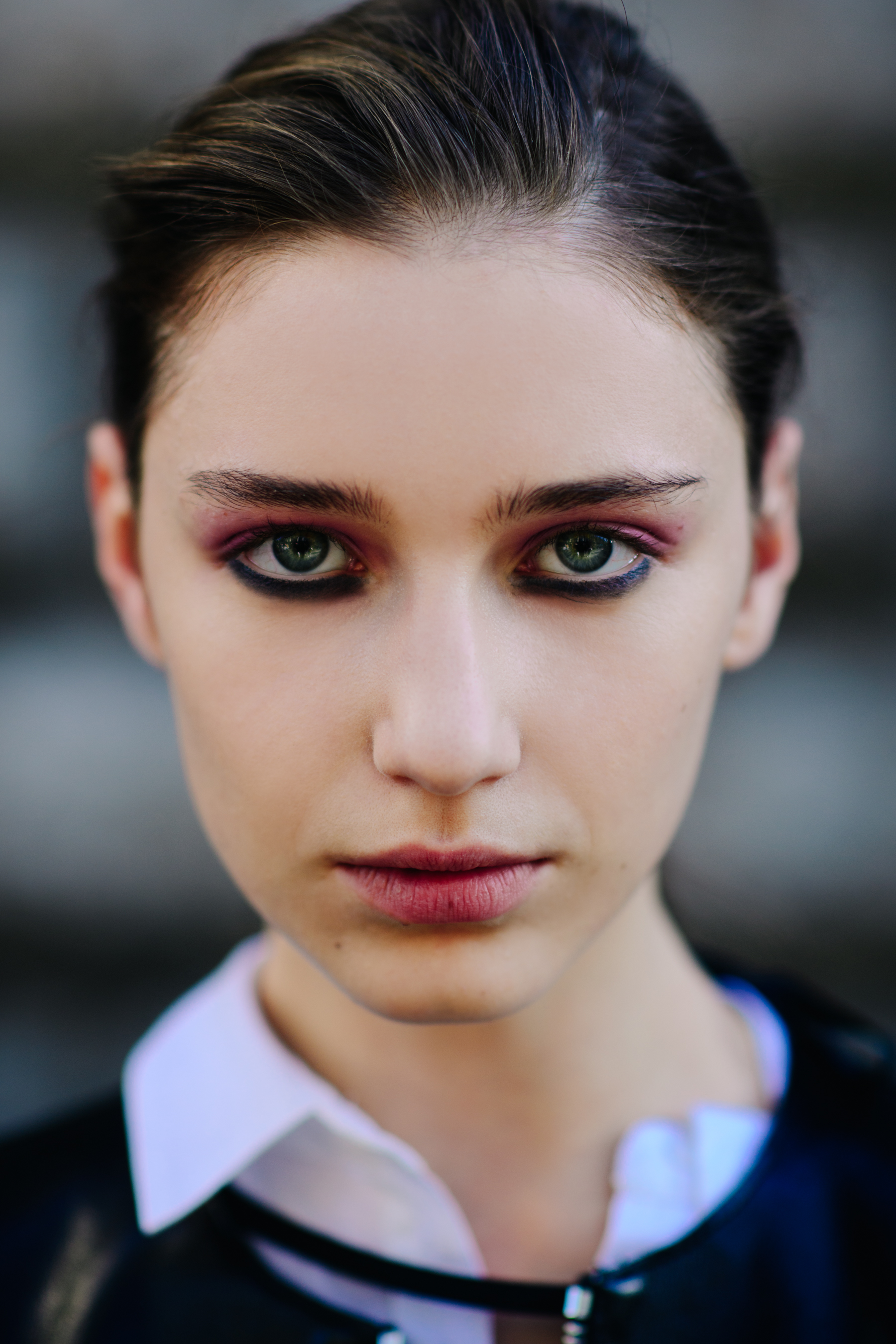 Portrait of Russian model with green eyes and pink eye shadow