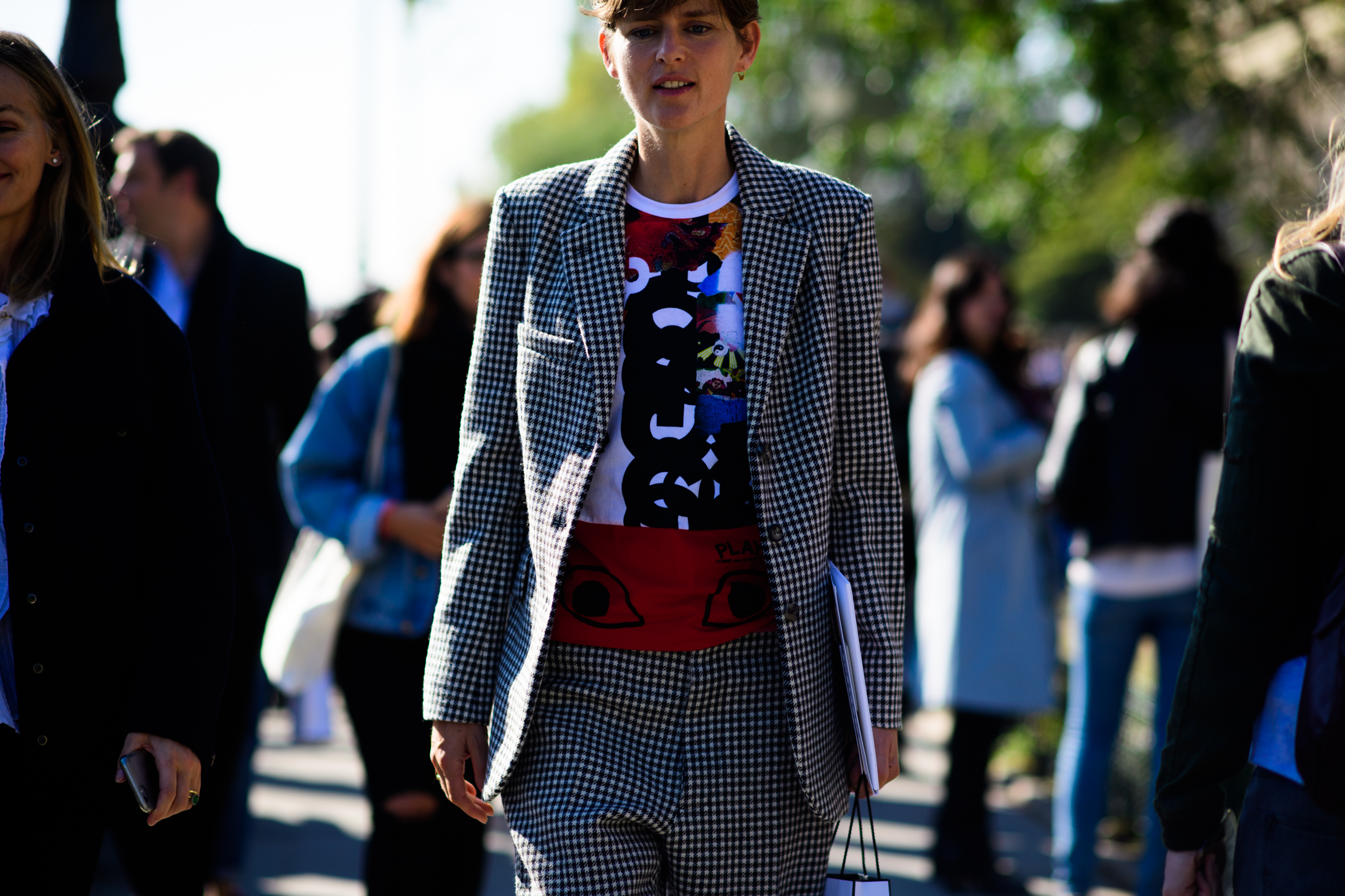 Woman wearing red tee shirt and suit jacket