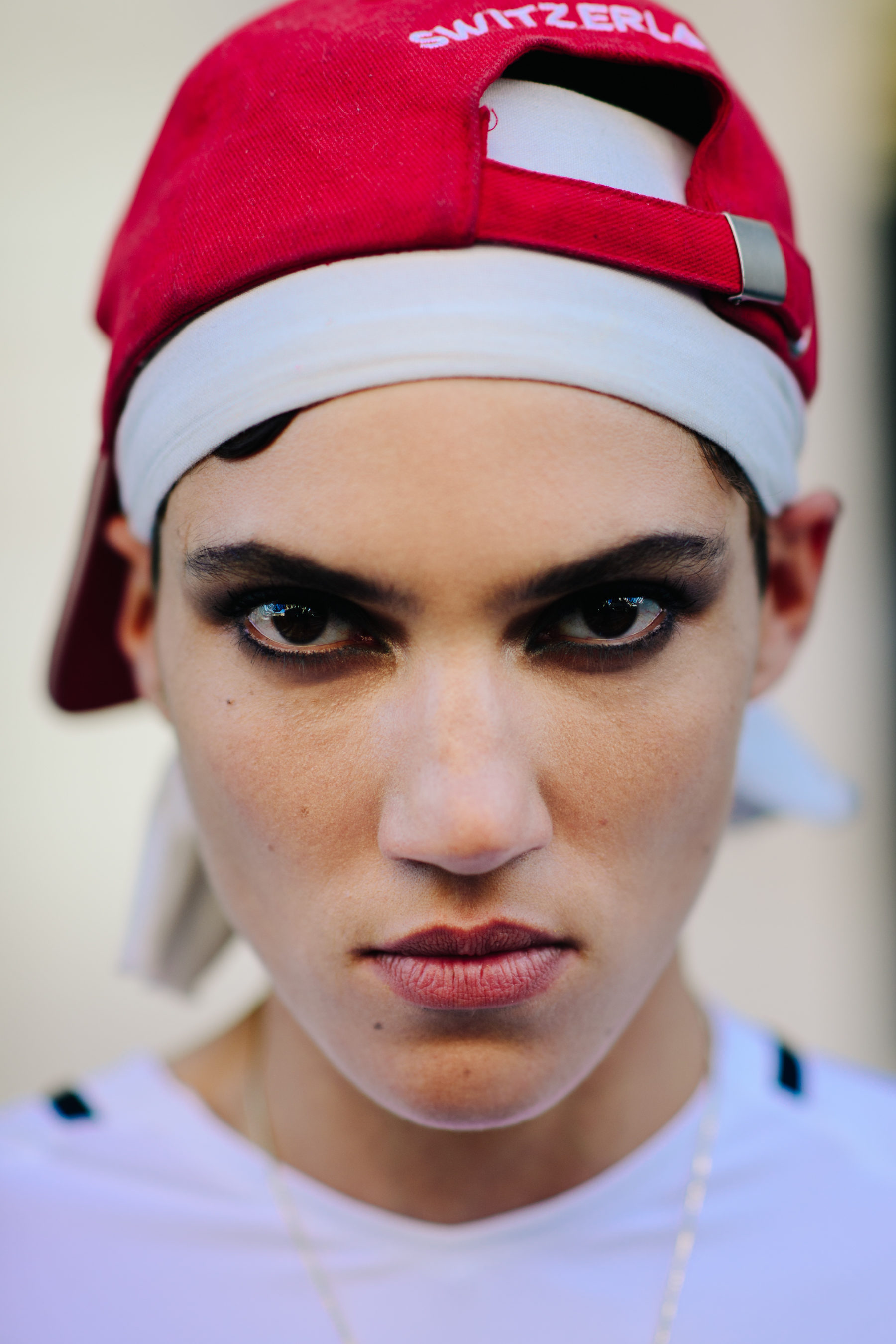 Portrait of model wearing red cap backwards