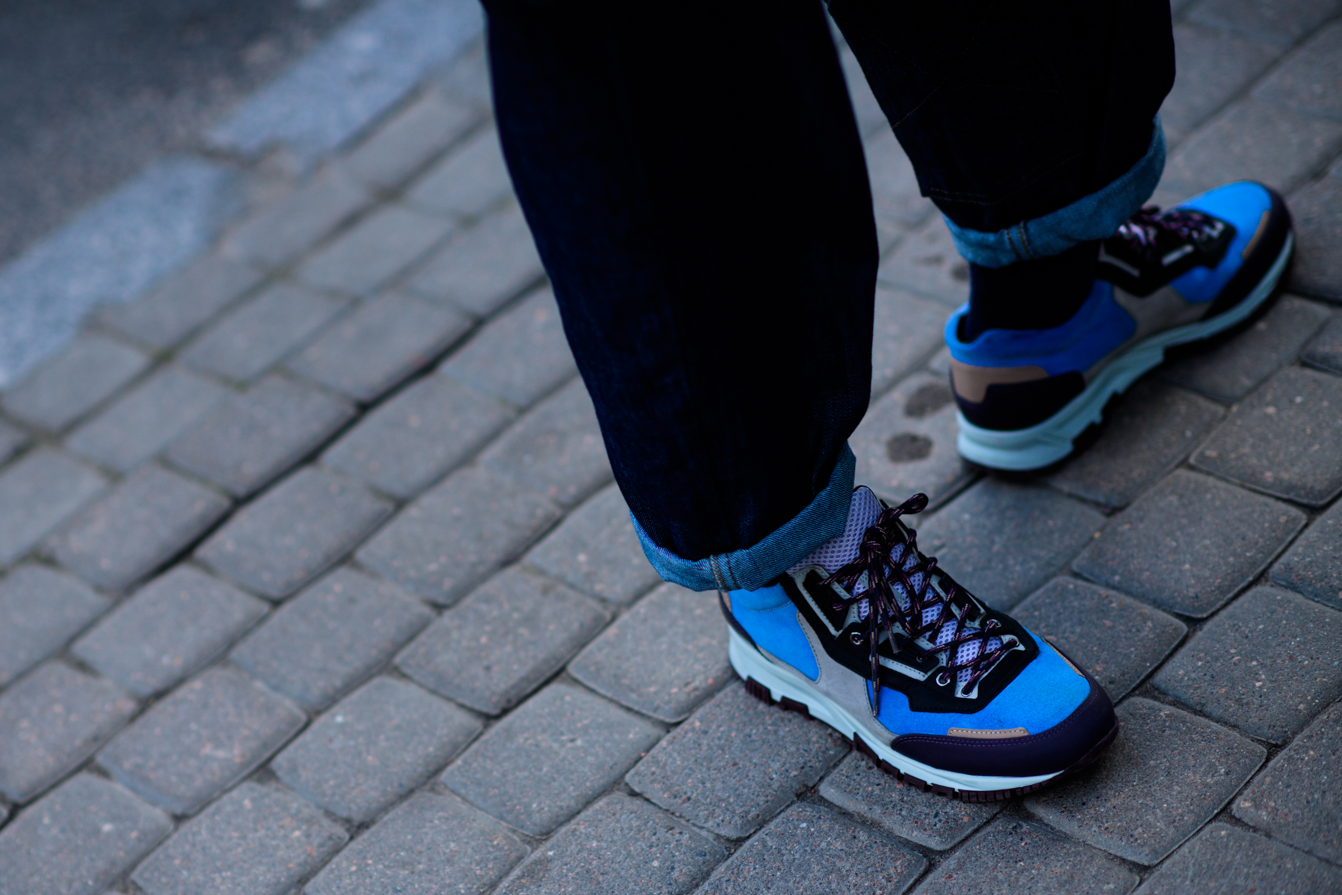 Man wearing colourful sneakers